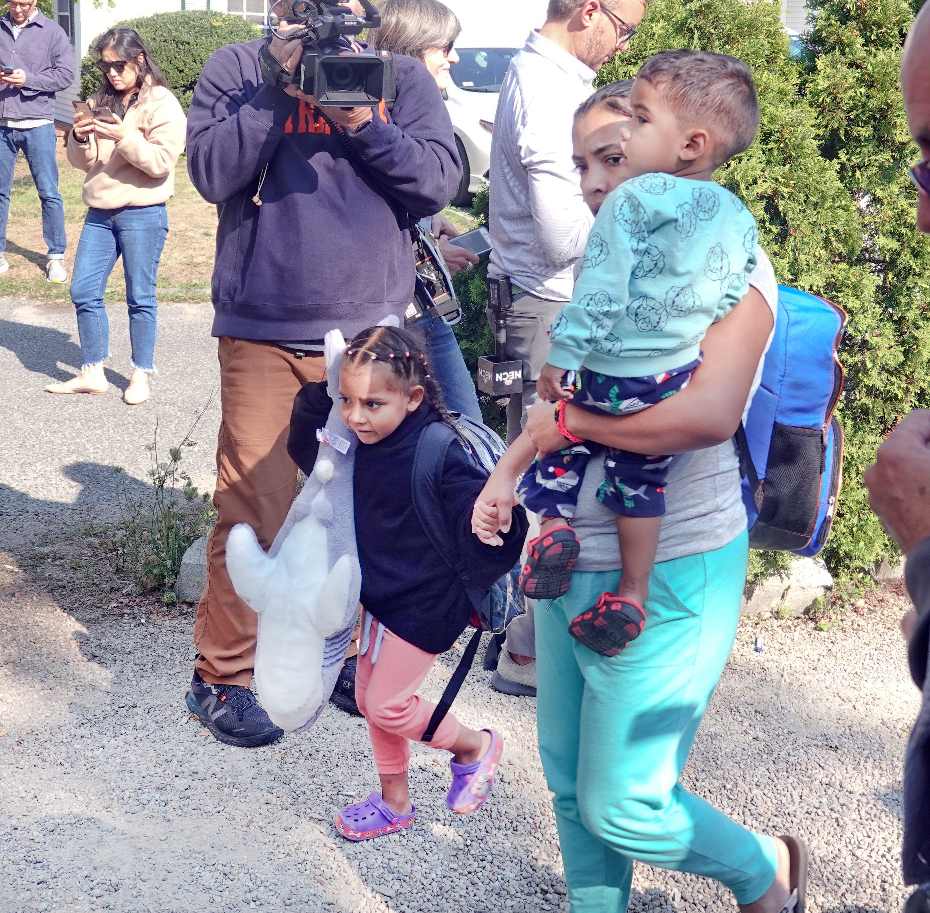 A family leaves Martha’s Vineyard for a larger shelter in Cape Cod on 16 September.