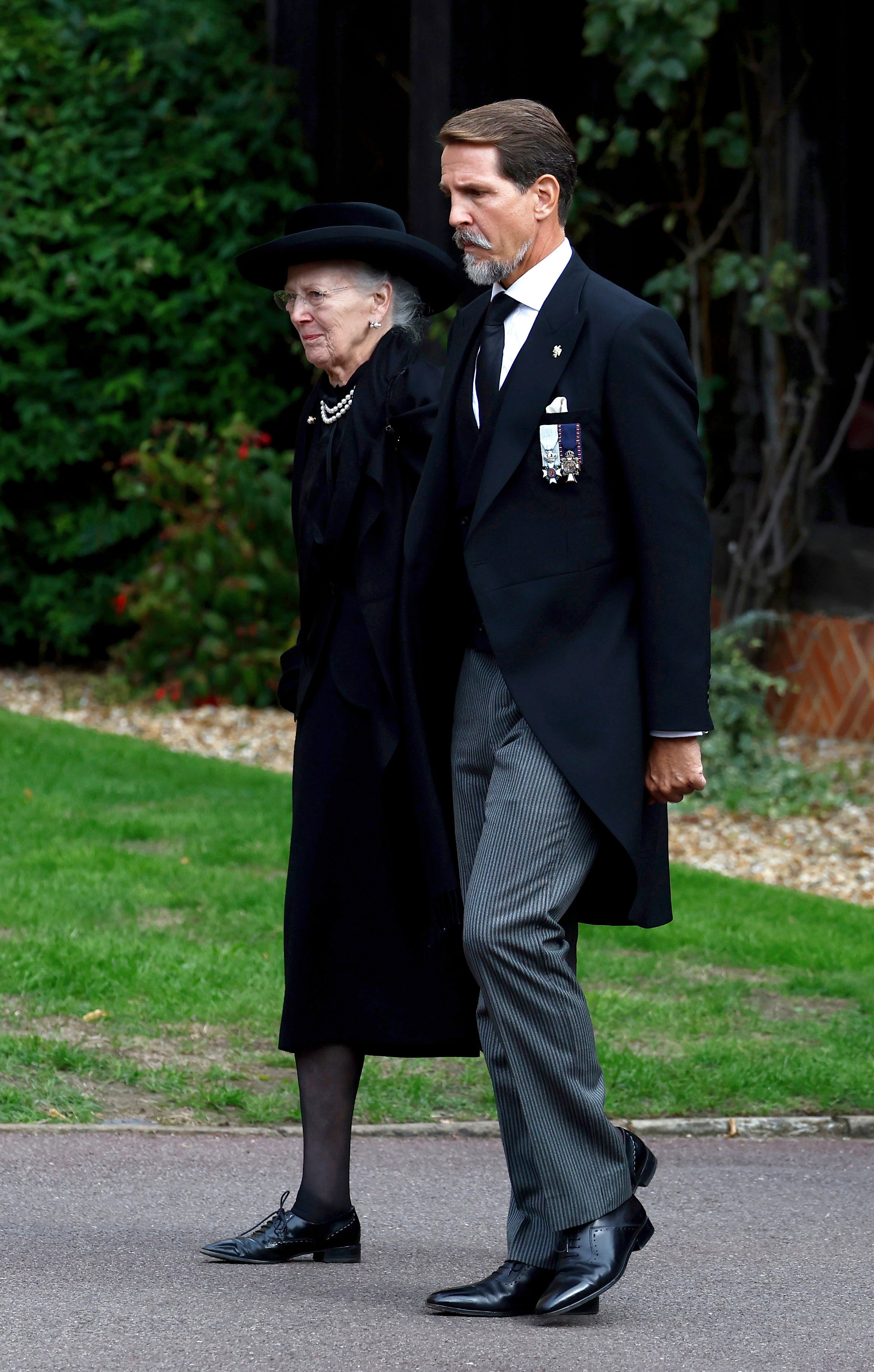 Queen Margrethe II of Denmark and Pavlos, Crown Prince of Greece arrive at St. George's Chapel, in Windsor