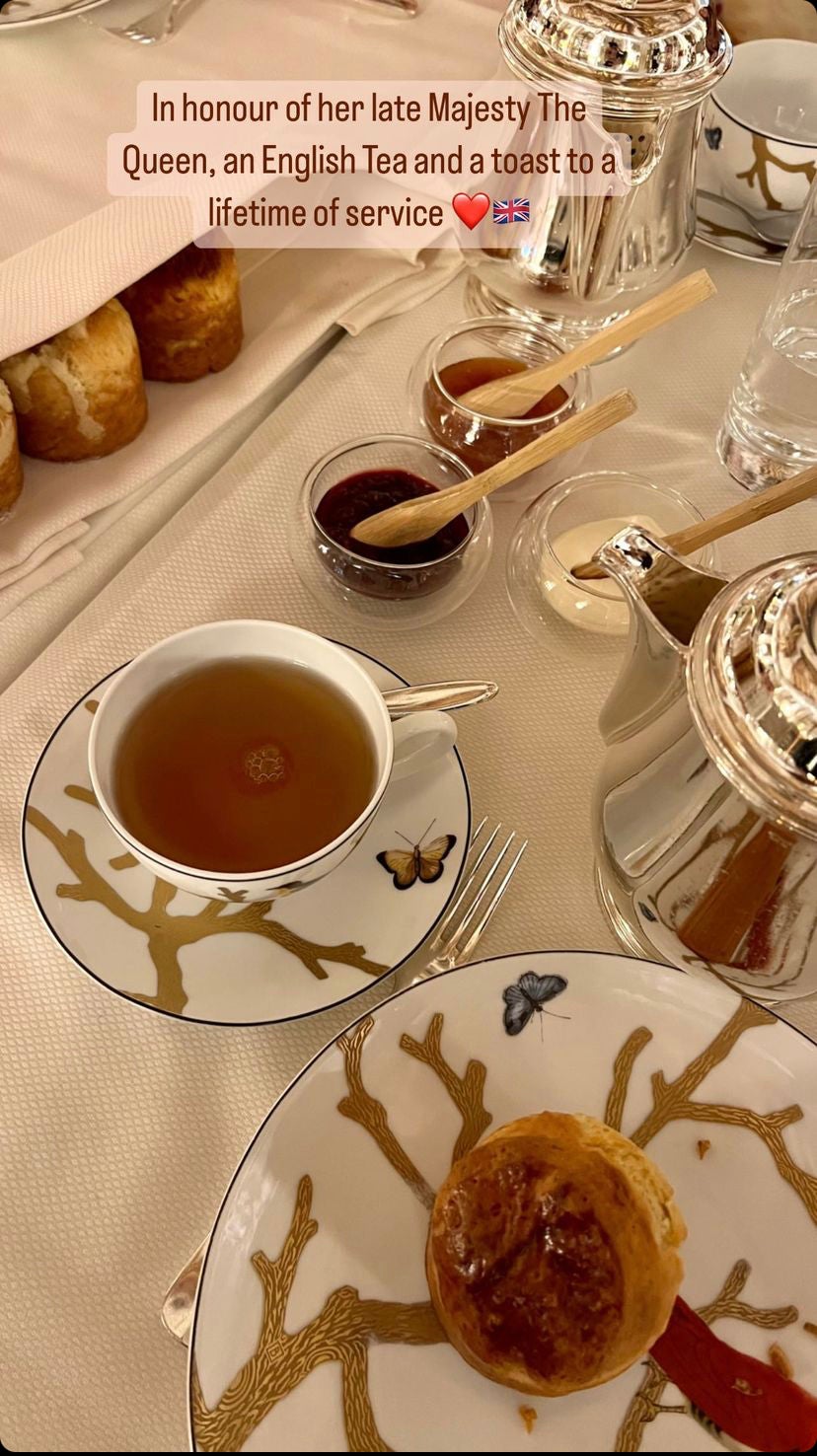 The Field-Williams family, who are based in America, enjoy a cream tea in honour of the Queen