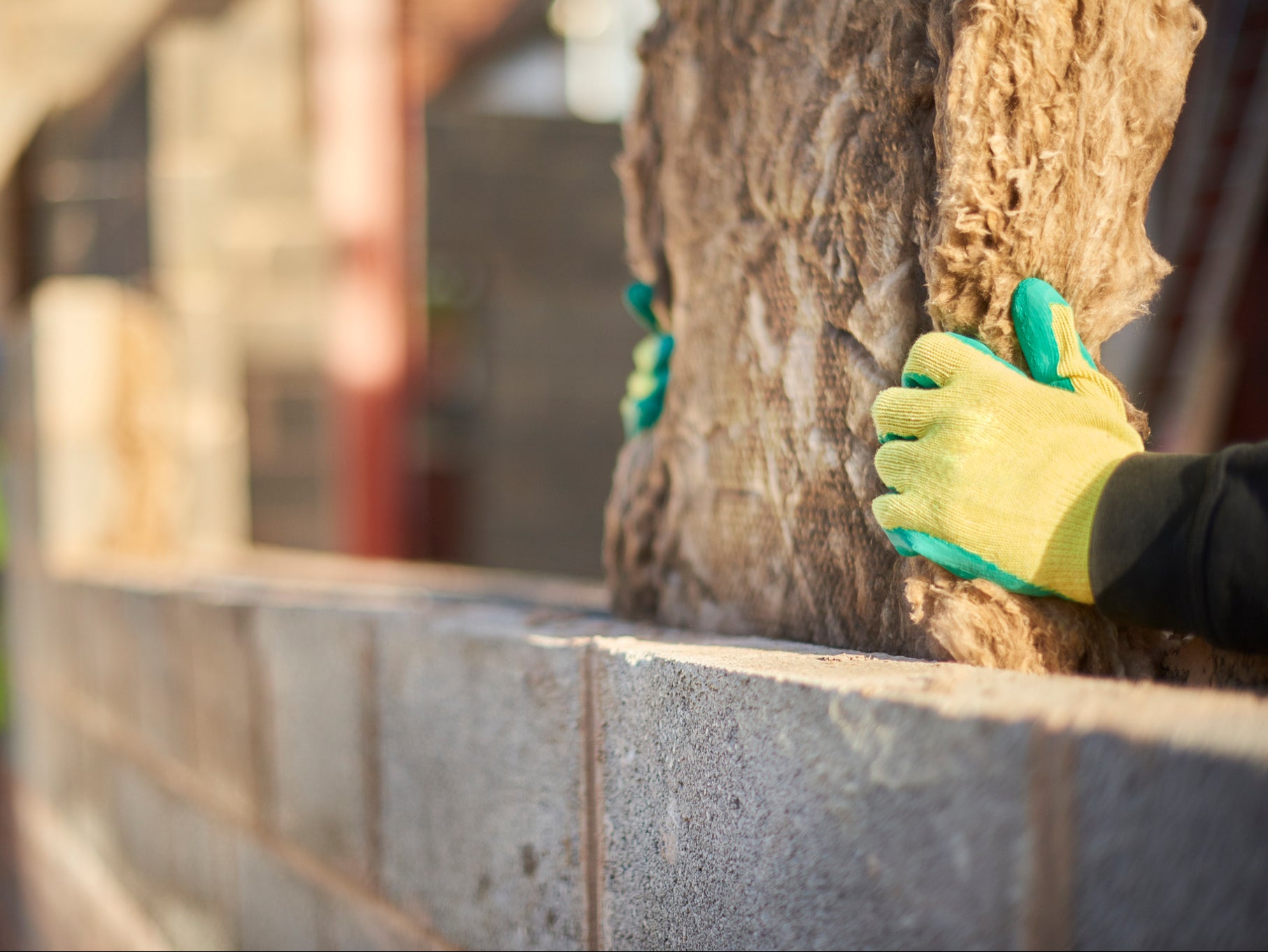 Fitting cavity wall insulation. Improving the efficiency of homes would be a major boost to the economy, analysts say