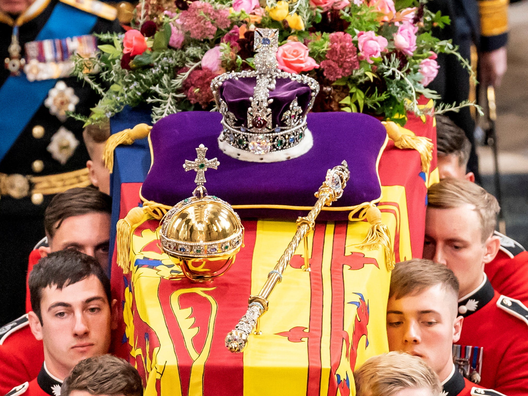 Orb, crown and sceptre atop the Queen’s coffin as it is carried from Westminster Abbey