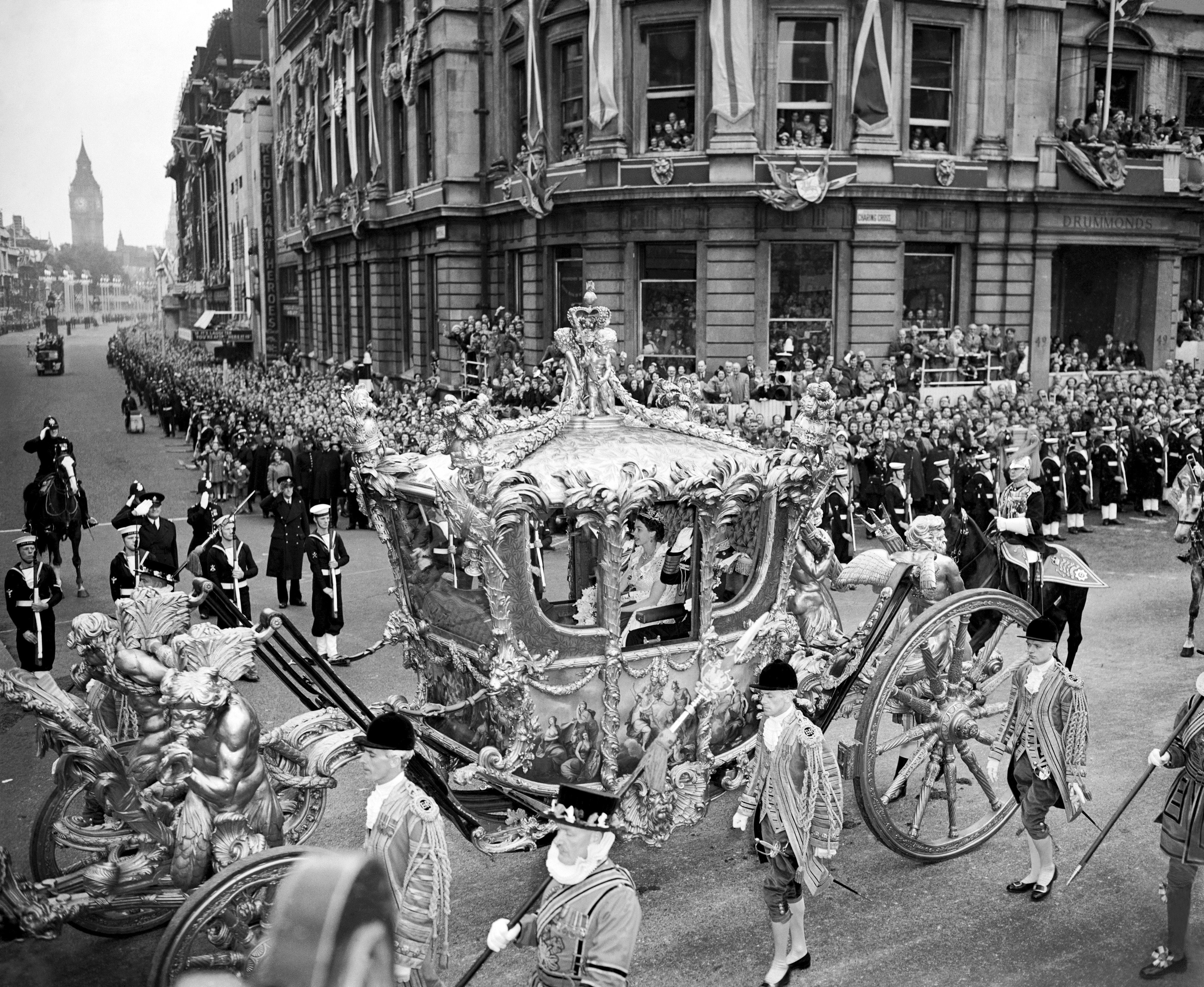 Queen Elizabeth II rides with the Duke of Edinburgh on the way to Westminster Abbey for her coronation