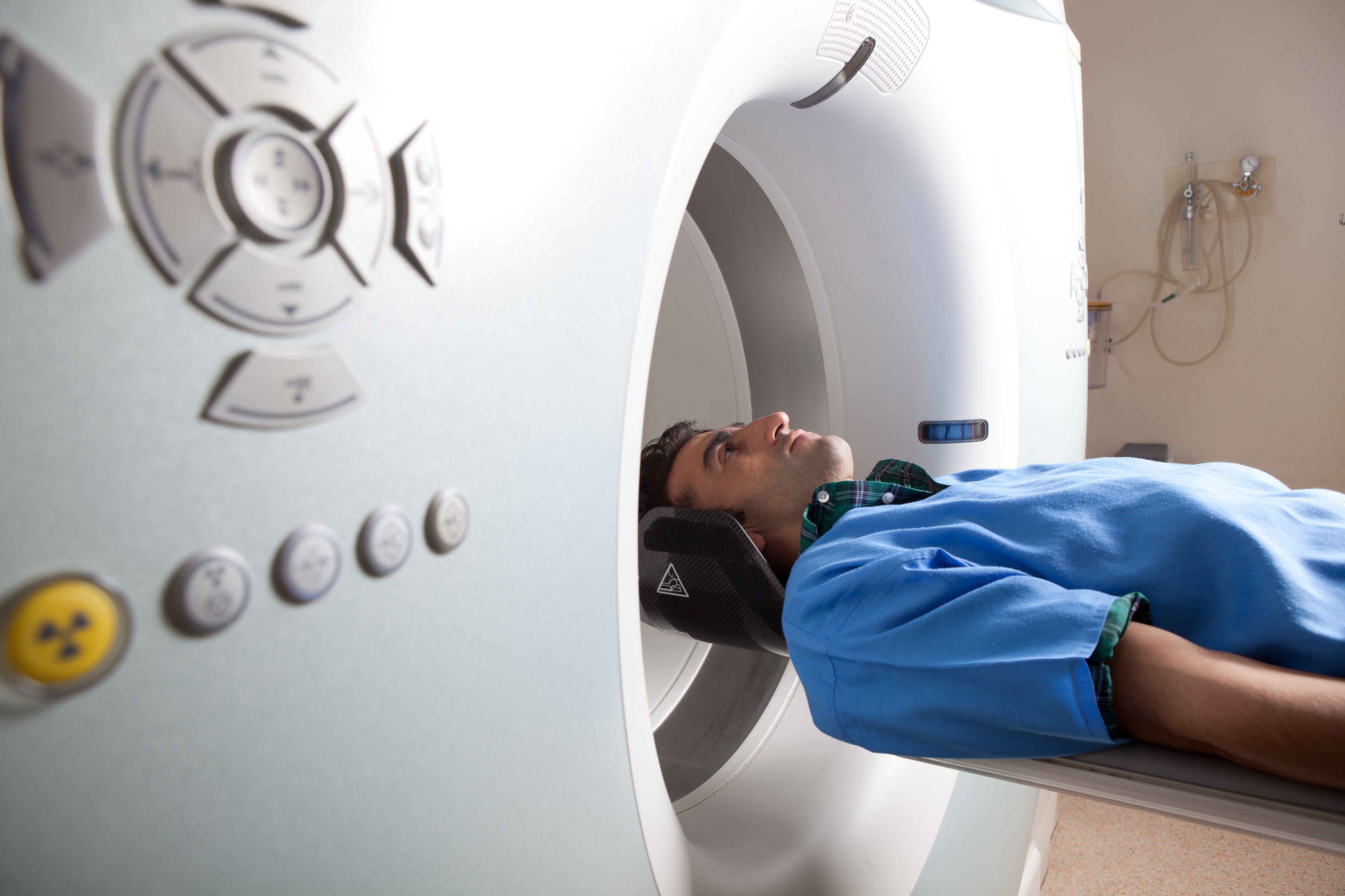 A man undergoes an MRI scan