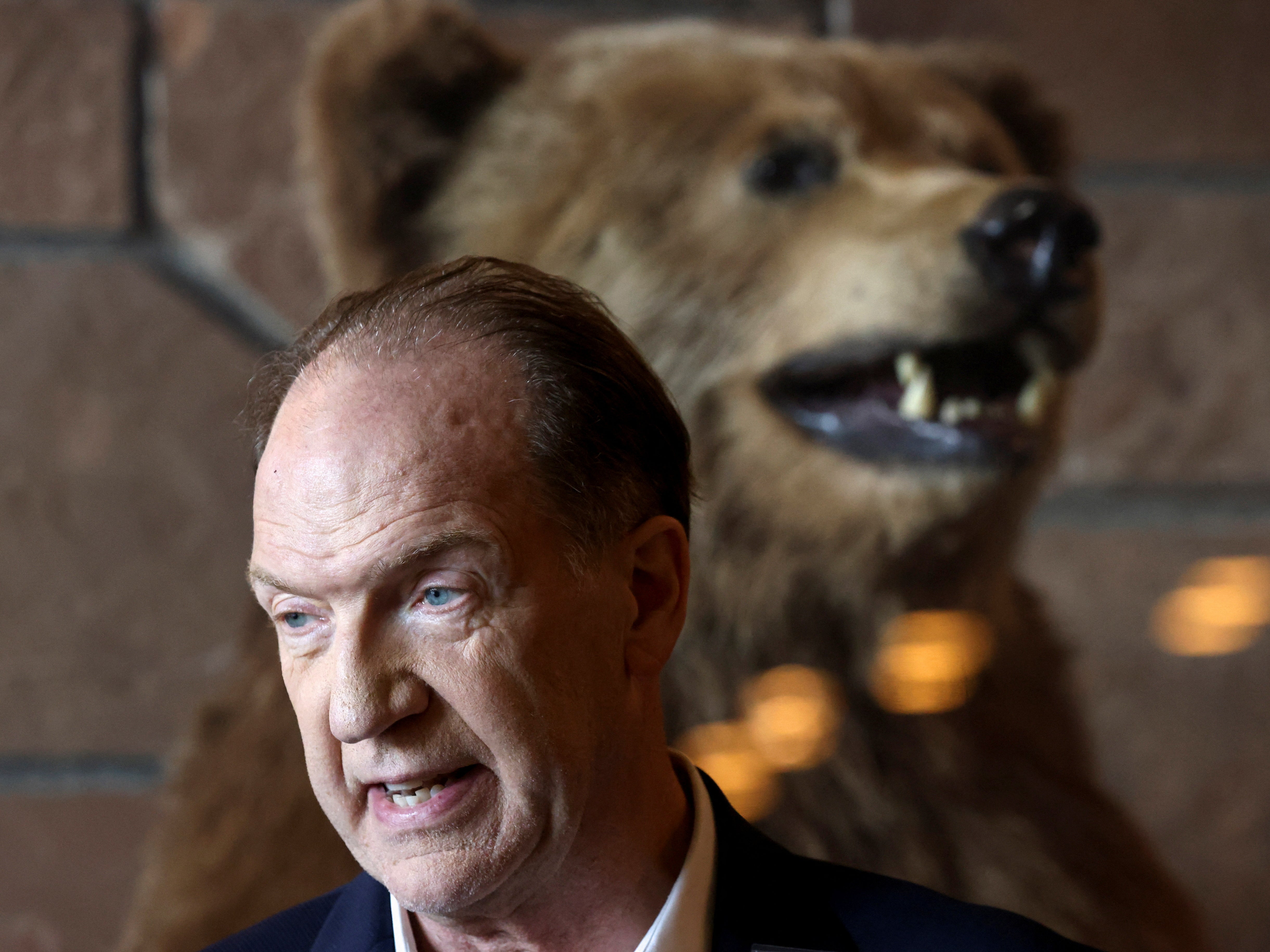 It’s behind you! David Malpass, president of the World Bank Group in front of a stuffed grizzly bear at the Jackson Hole Economic Symposium, in Wyoming