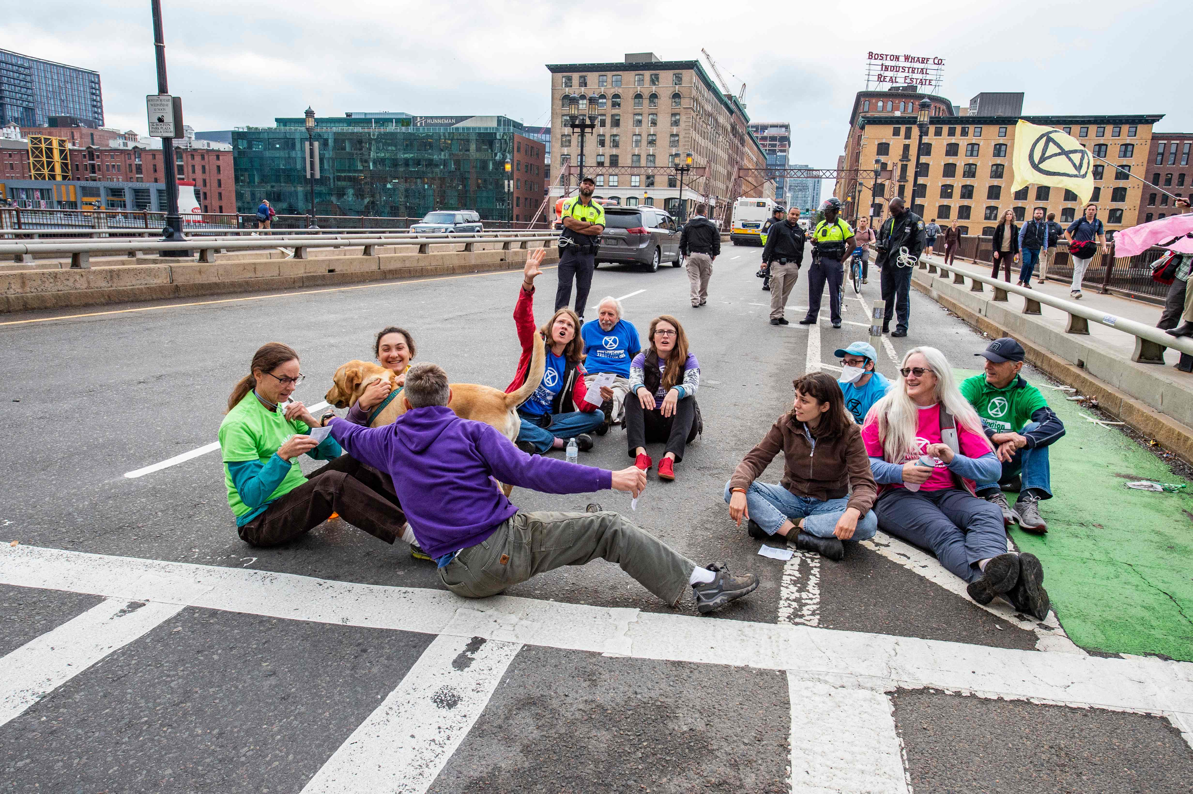 Climate protestors with Extinction Rebellion block a road in Boston on Wednesday morning