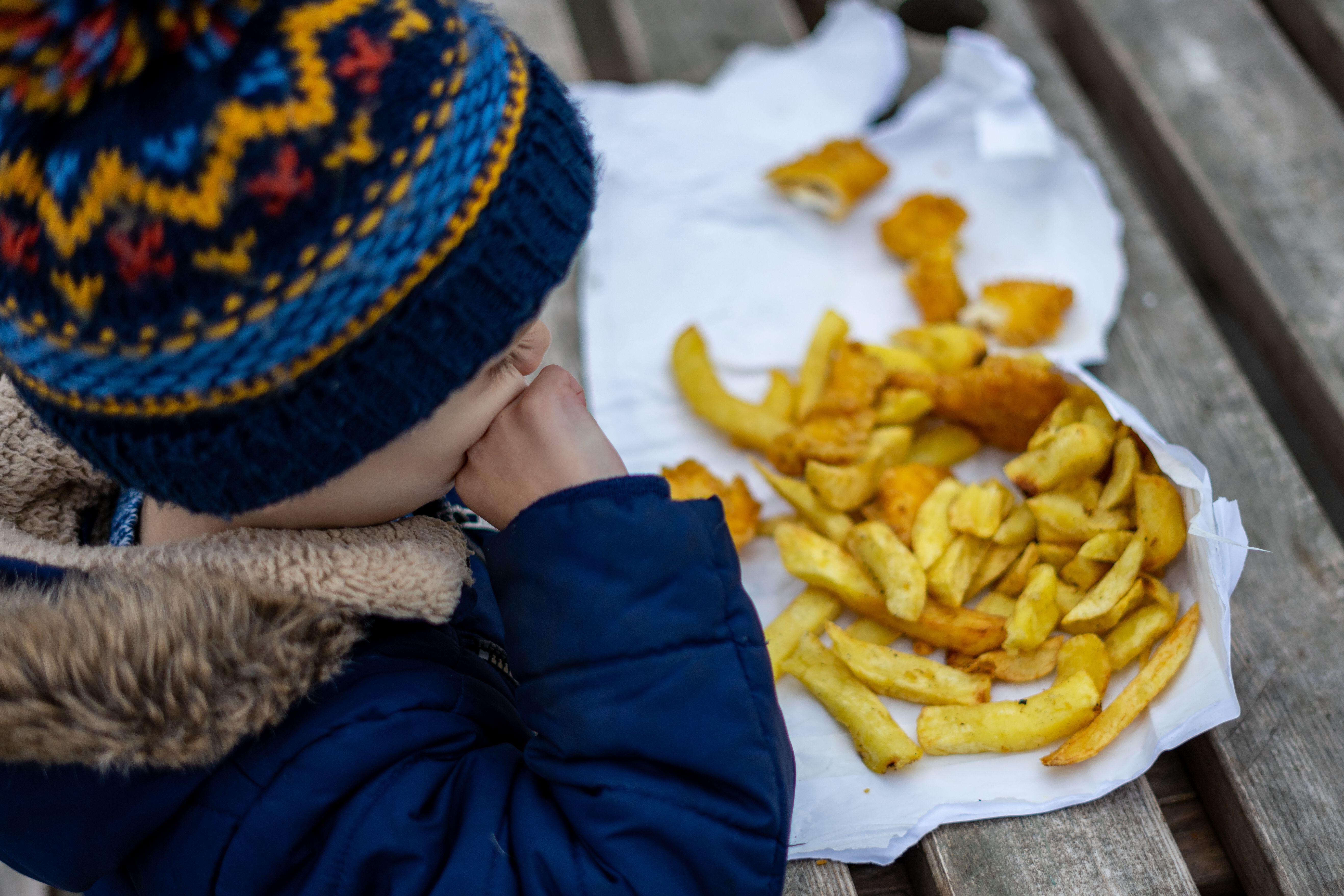 The letter said cutting preventable illness caused by junk food would be crucial in tackling the NHS backlog (Alamy/PA)