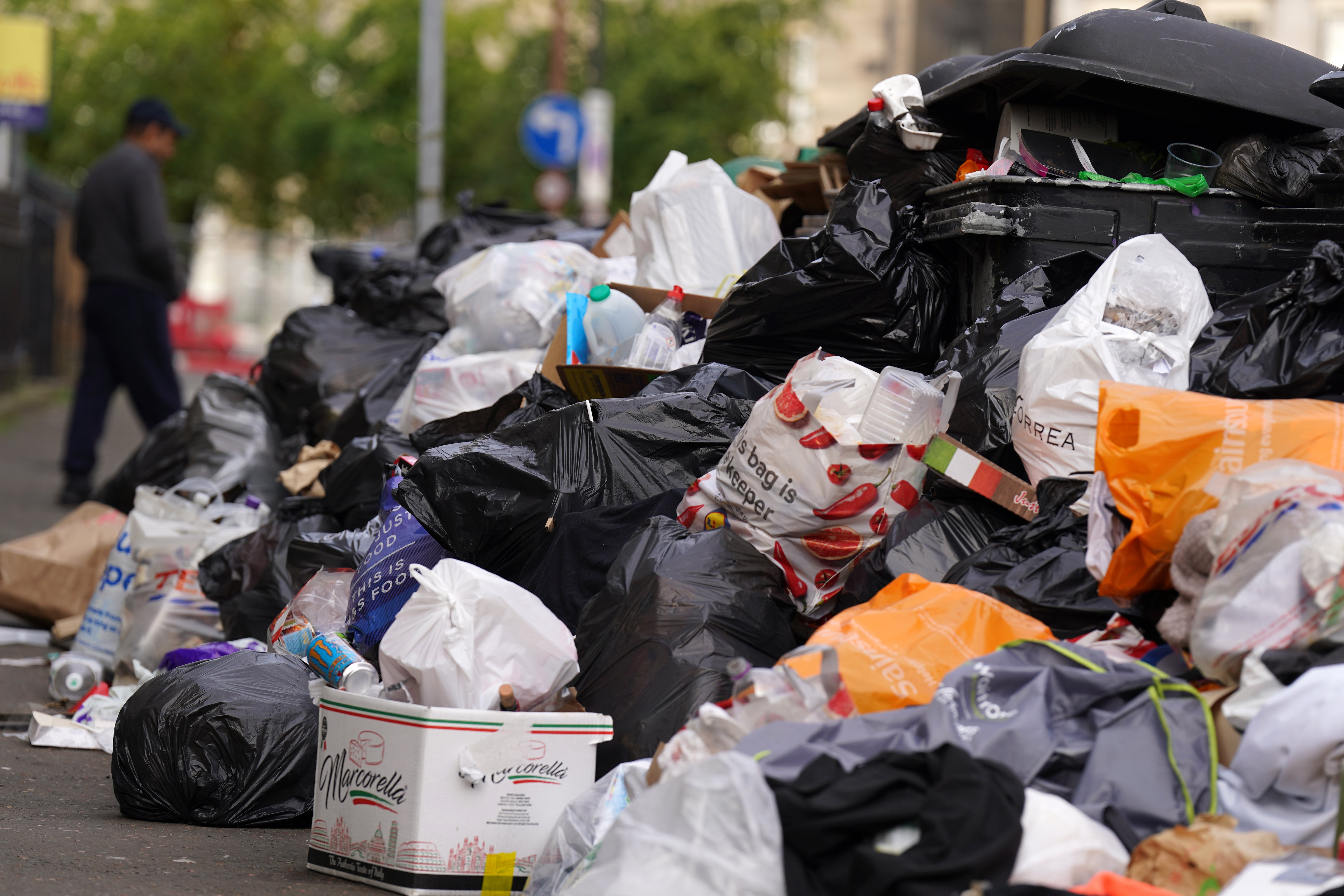 Overflowing bins on the streets of Edinburgh earlier this summer (Andrew Milligan/PA)