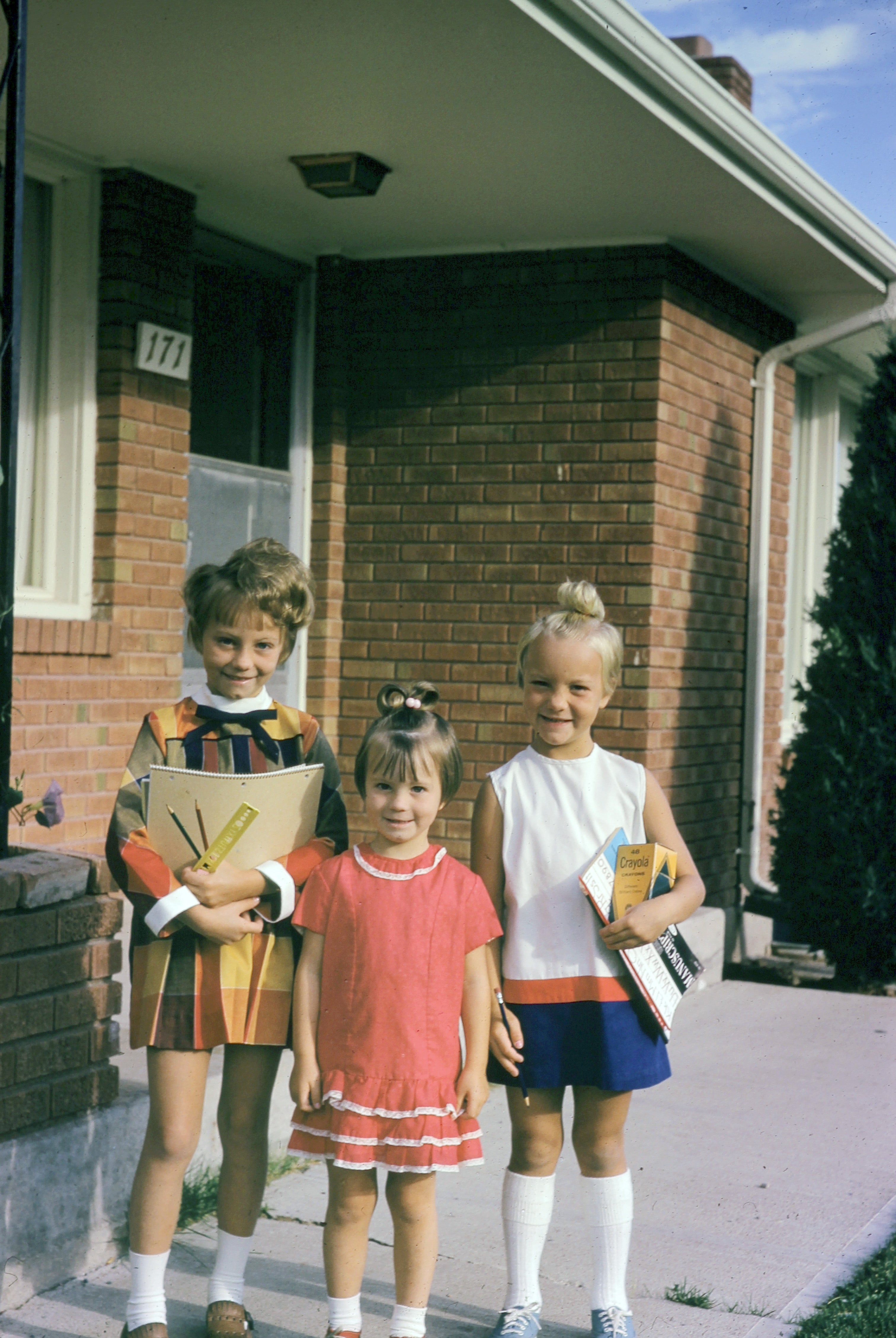 Jan, left, readies for school with her younger sisters at their home in Pocatello, Idaho, in 1969