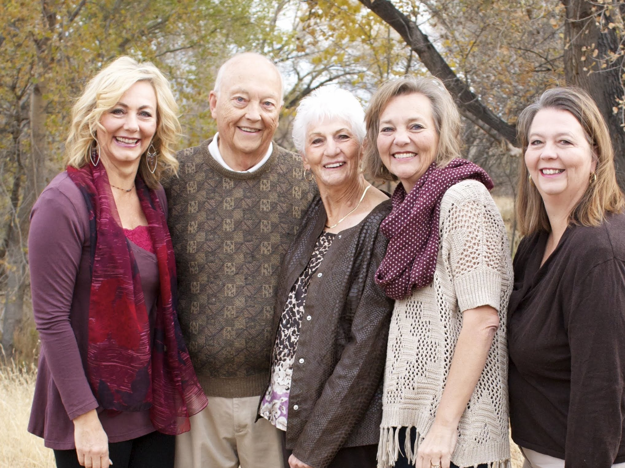 Jan, left, poses with her parents and sisters in 2015