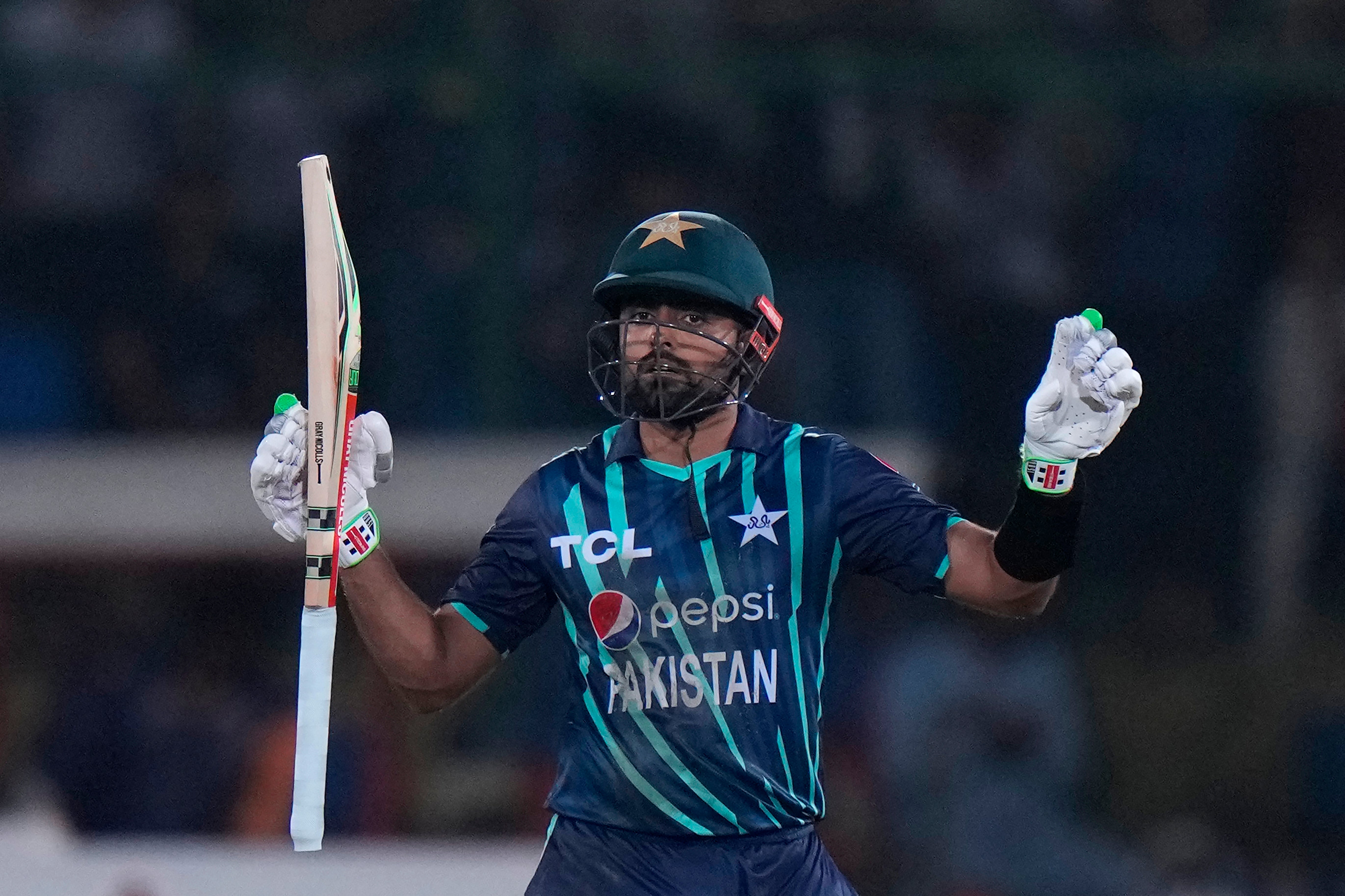 Pakistan captain Babar Azam celebrates scoring a century (Anjum Naveed/AP)