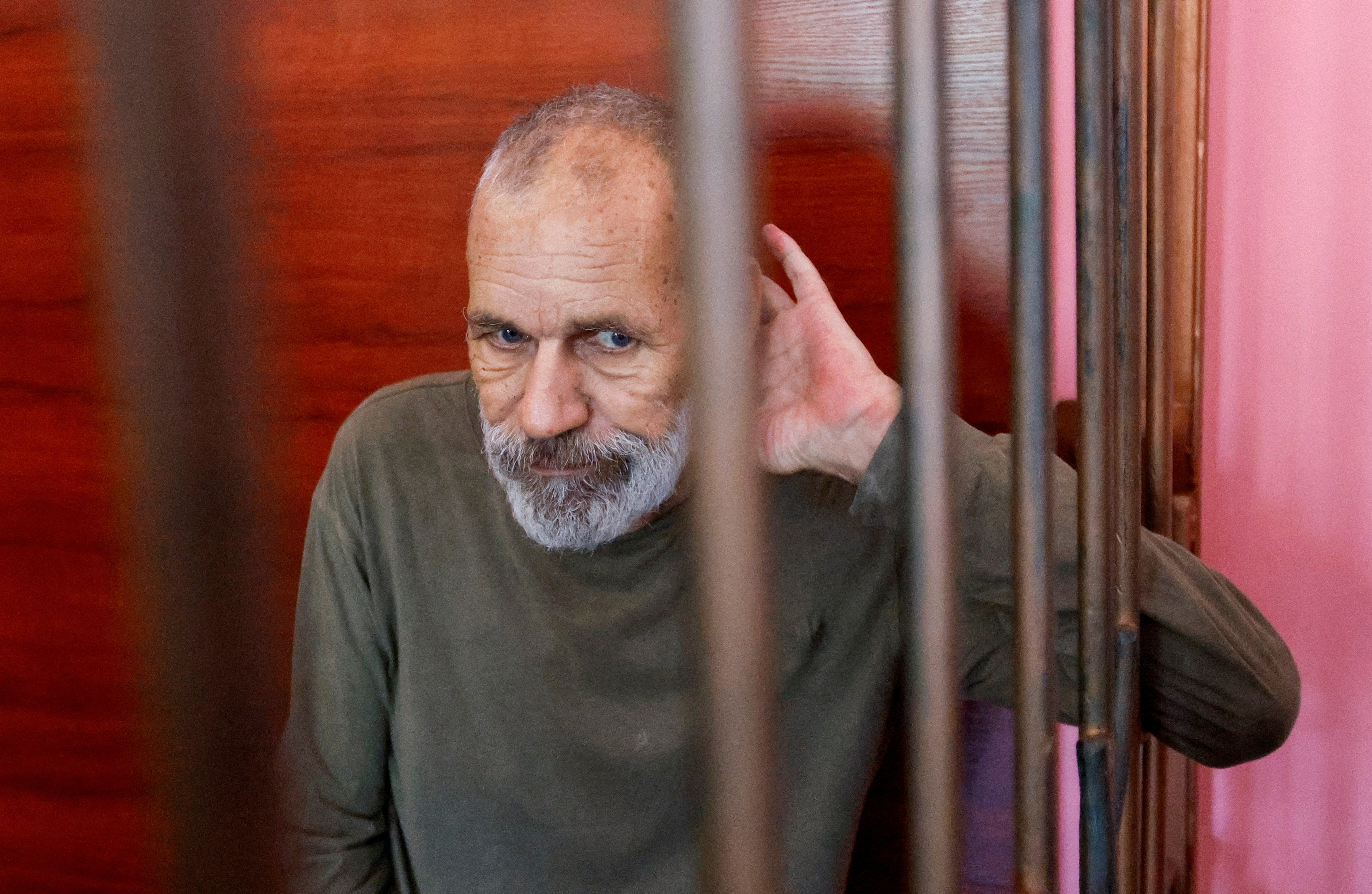 British national John Harding, who was captured by pro-Russian forces while allegedly fighting for Ukrainian troops during Ukraine-Russia conflict, sits inside a defendants’ cage during a court hearing in Donetsk, Ukraine on 15 August 2022