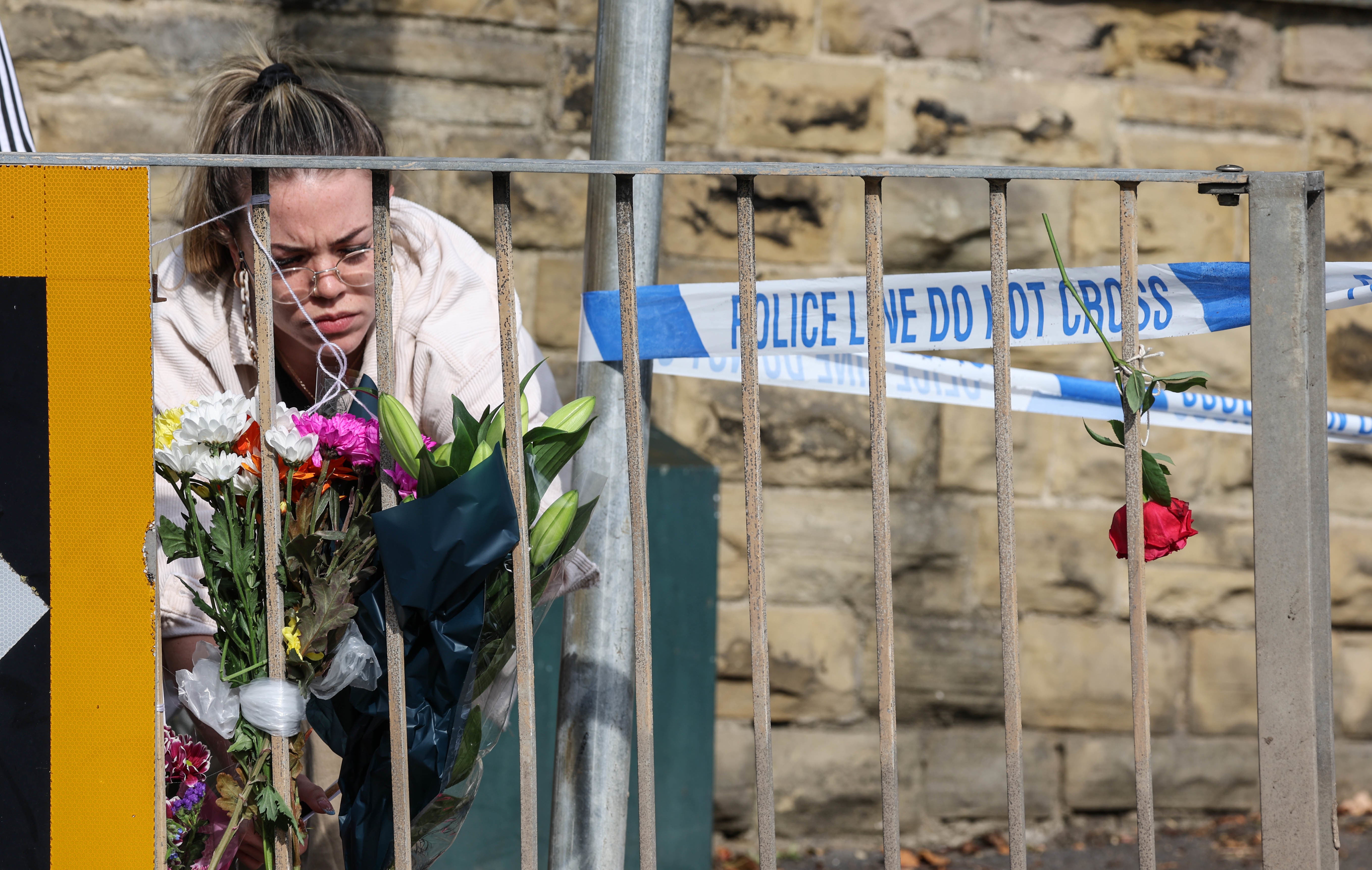 Floral tributes left near the scene in Woodhouse Hill, Huddersfield (Nigel Roddis/PA)