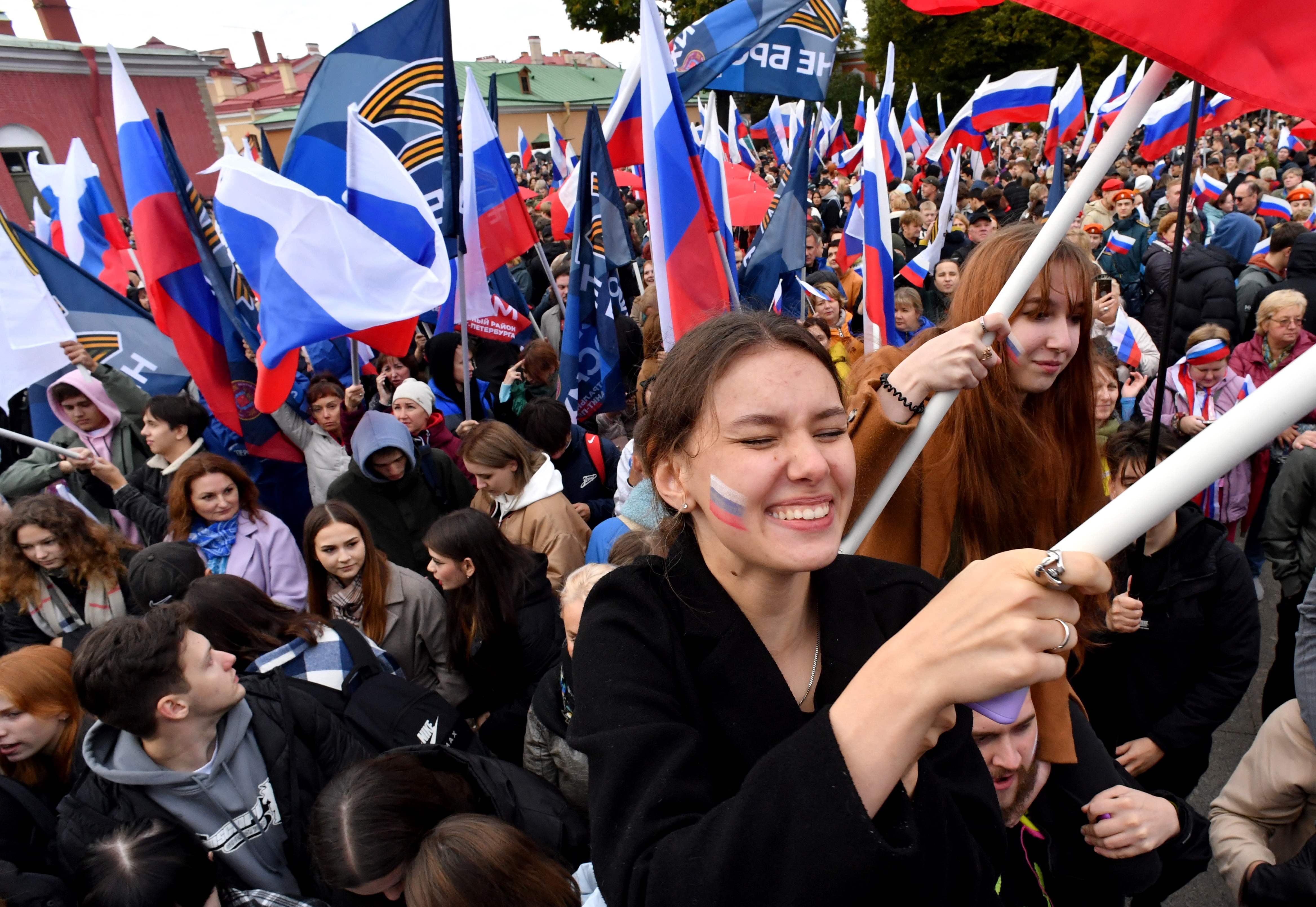 People attend a rally and a concert in support of referendums in Russian-held regions of Ukraine, in St Petersburg on Friday