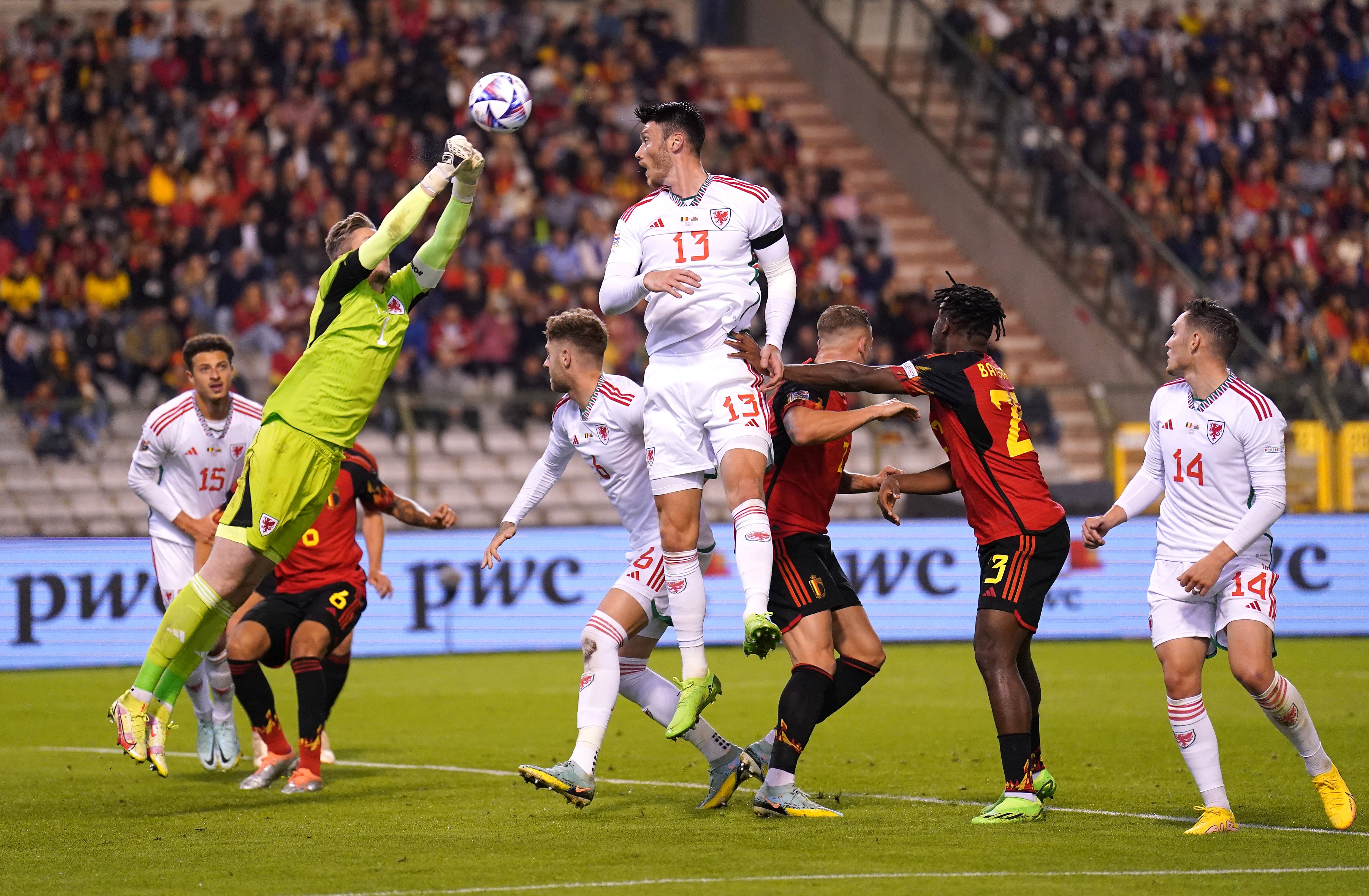 Wayne Hennessey punches the ball clear during Wales’ 2-1 Nations League defeat by Belgium in Brussels (Tim Goode/PA)