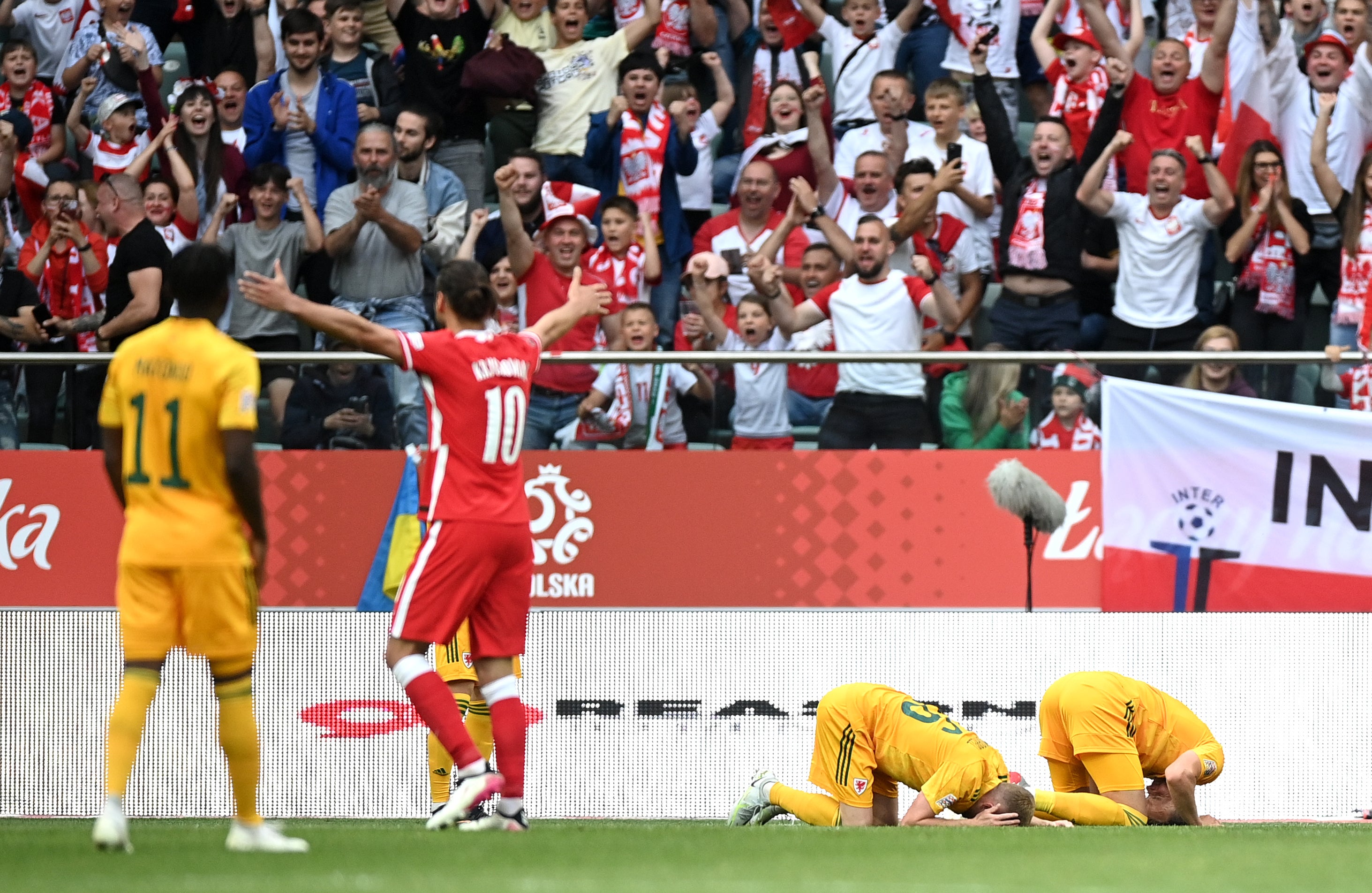 Wales players are dejected after conceding during their 2-1 Nations League defeat to Poland in June (Rafal Oleksiewicz/PA)