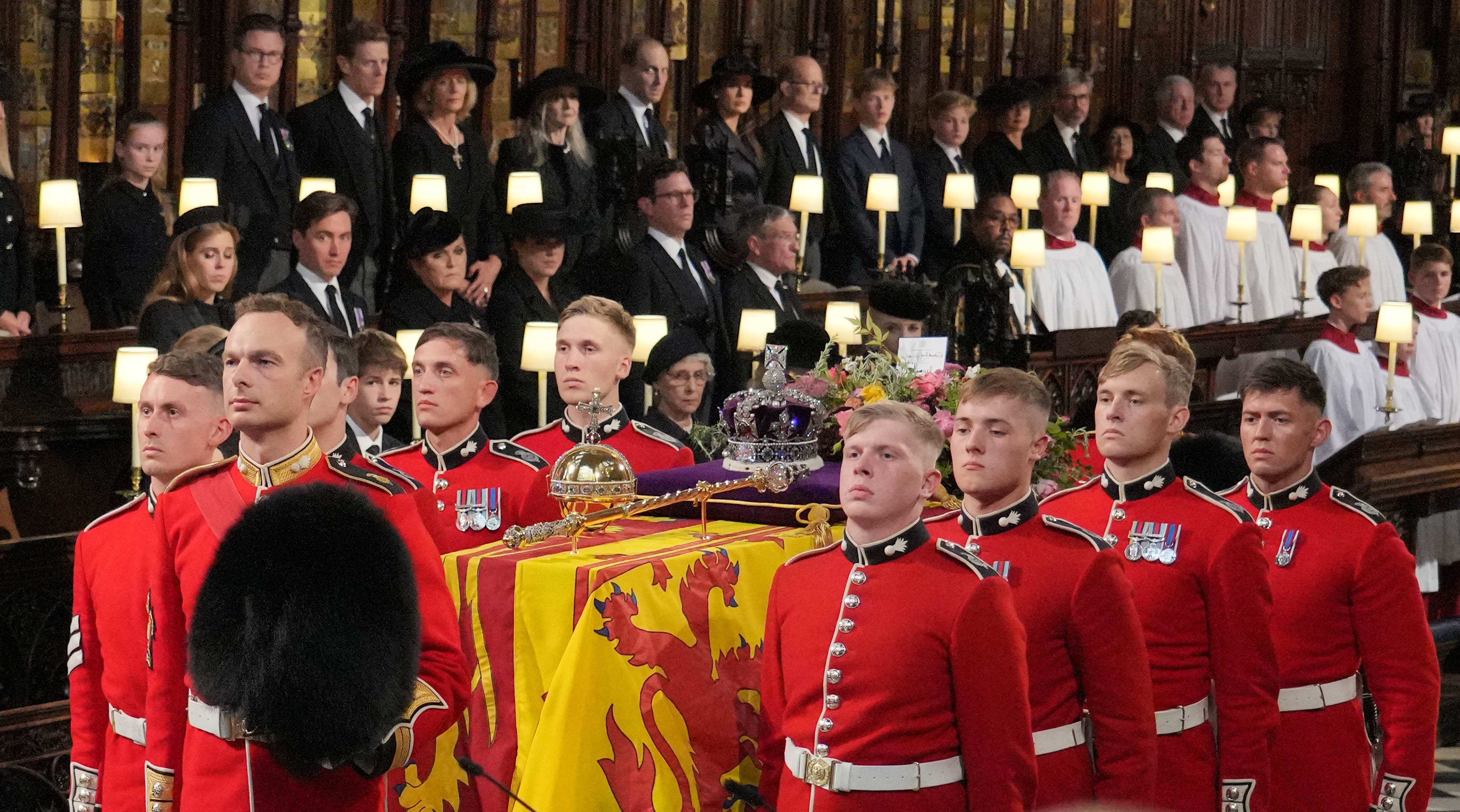 David Sanderson, 19, is seen carrying the Queen’s casket at the front right hand side