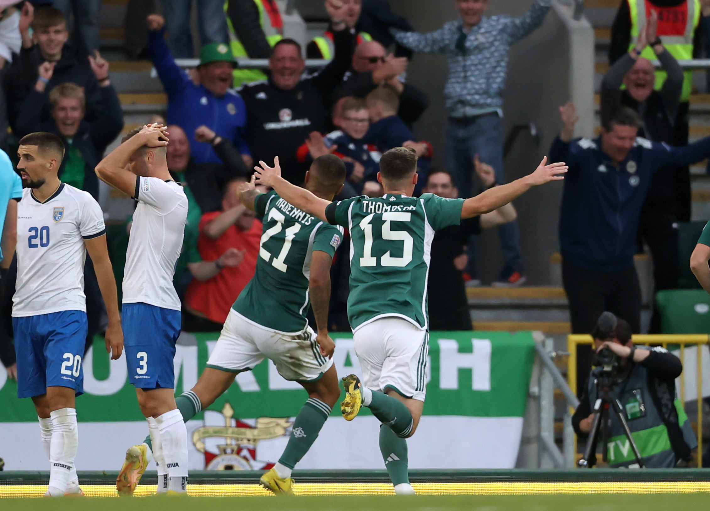 Josh Magennis, centre, celebrates his late winner (Liam McBurney/PA)