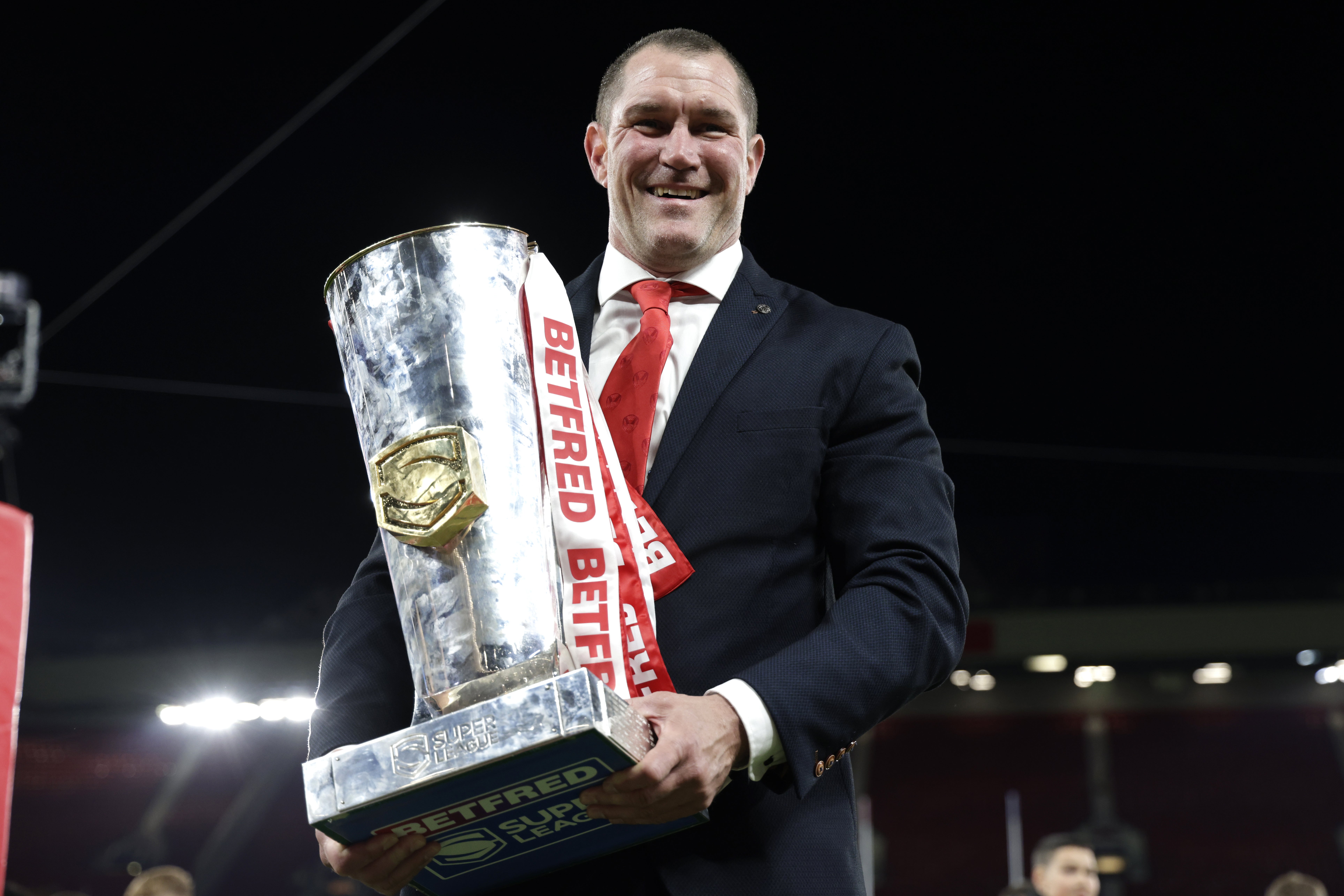 Kristian Woolf celebrates his third and St Helens’ fourth Grand Final win in succession (Richard Sellers/PA)