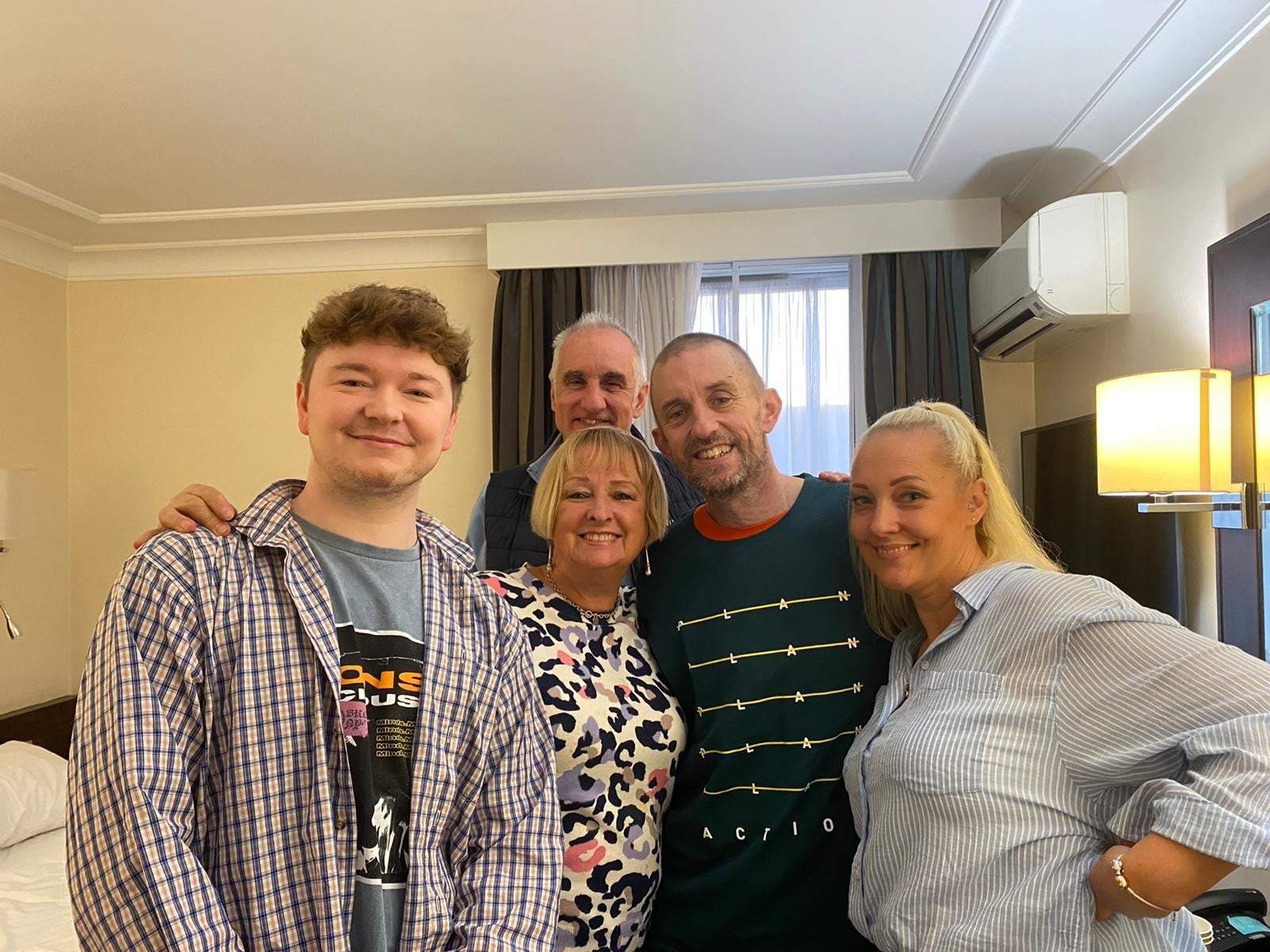 Mr Aslin’s fellow ex-captive Shaun Pinner (centre) said he was ‘looking forward to steak and a glass of red wine’ after arriving in the UK (FCDO/PA)