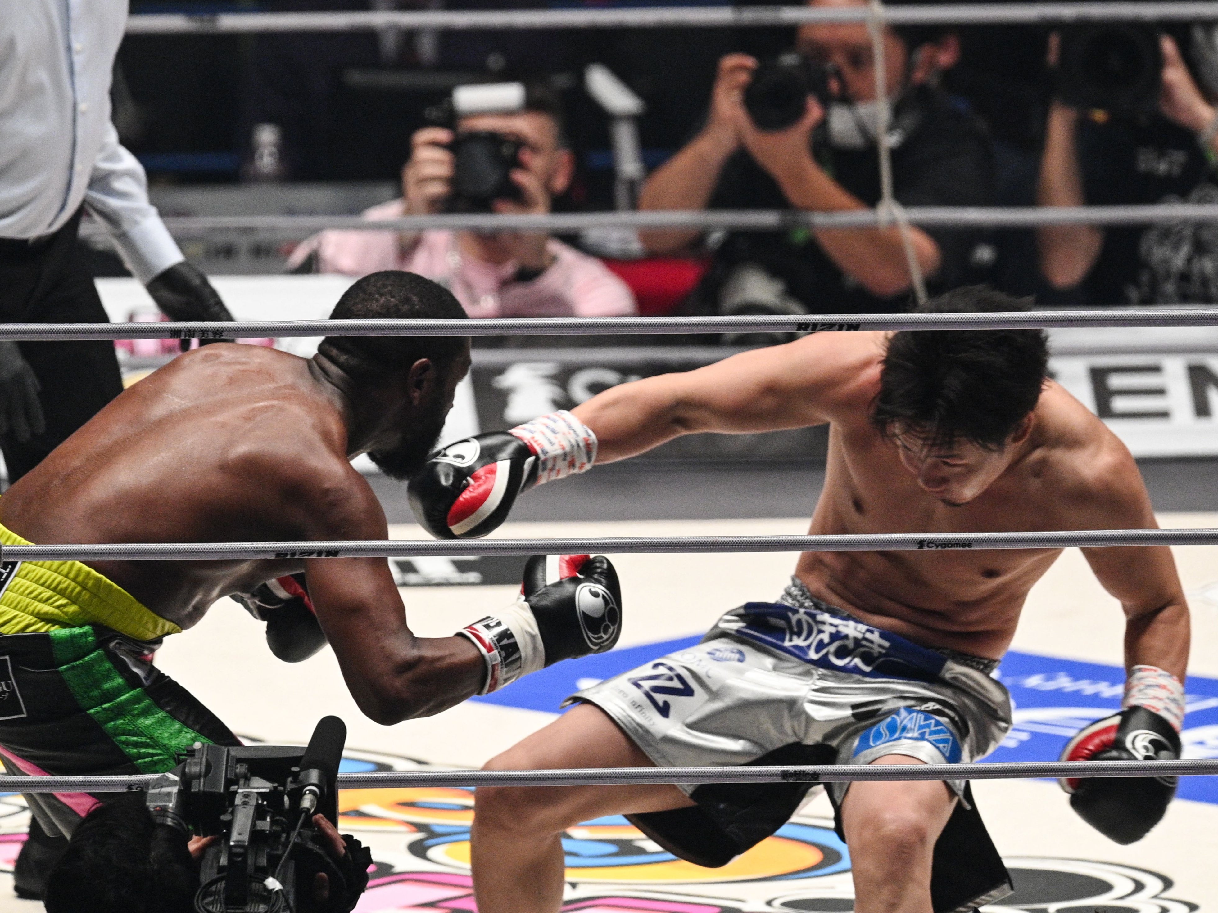 Mayweather drops Asakura with the final punch of the second round