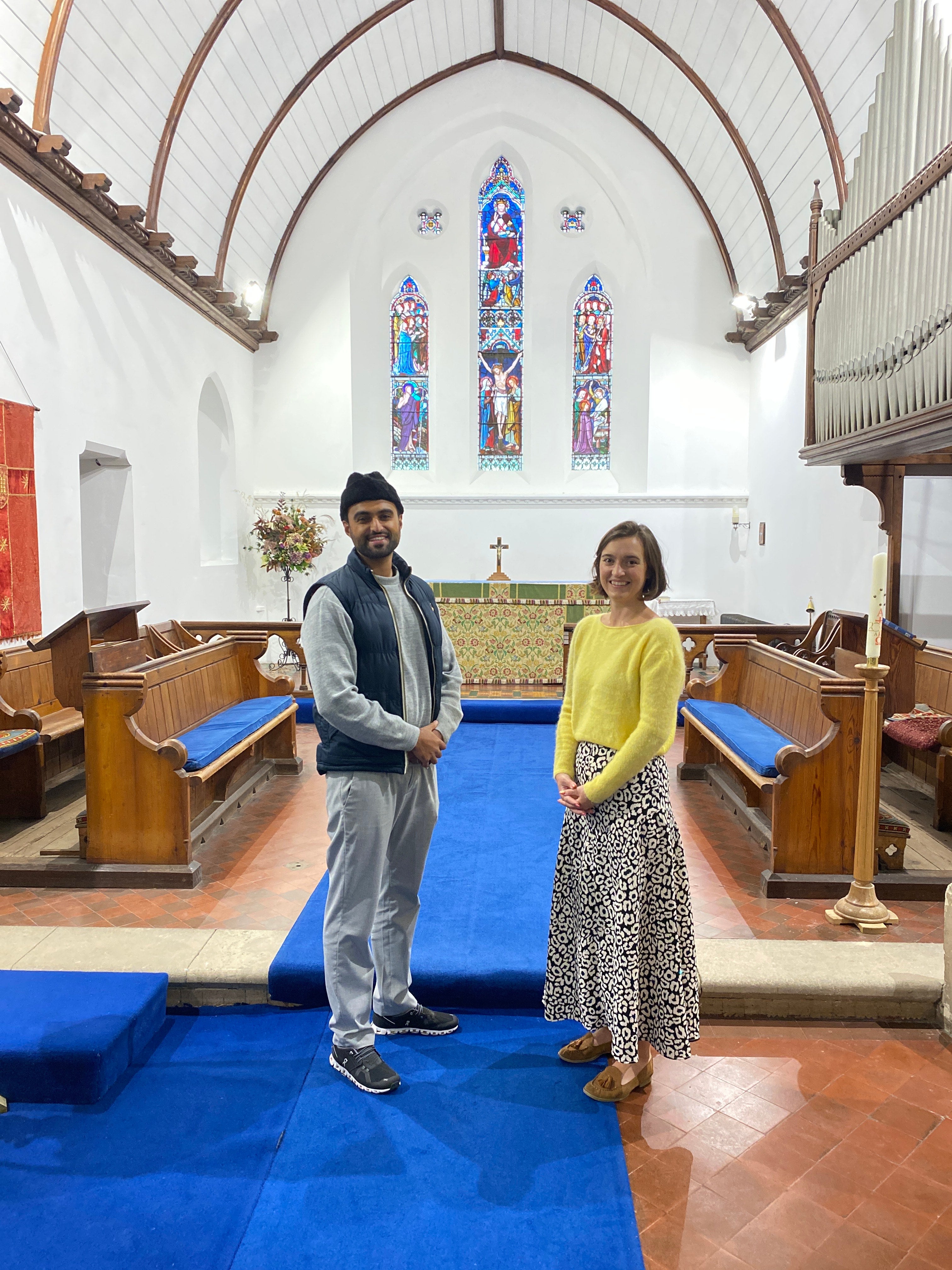 Sabah Ahmedi, who is one of Britain’s youngest Imams, with Charlotte Mathias, treasurer at All Saints Church in Tilford (MKA-UK/PA)