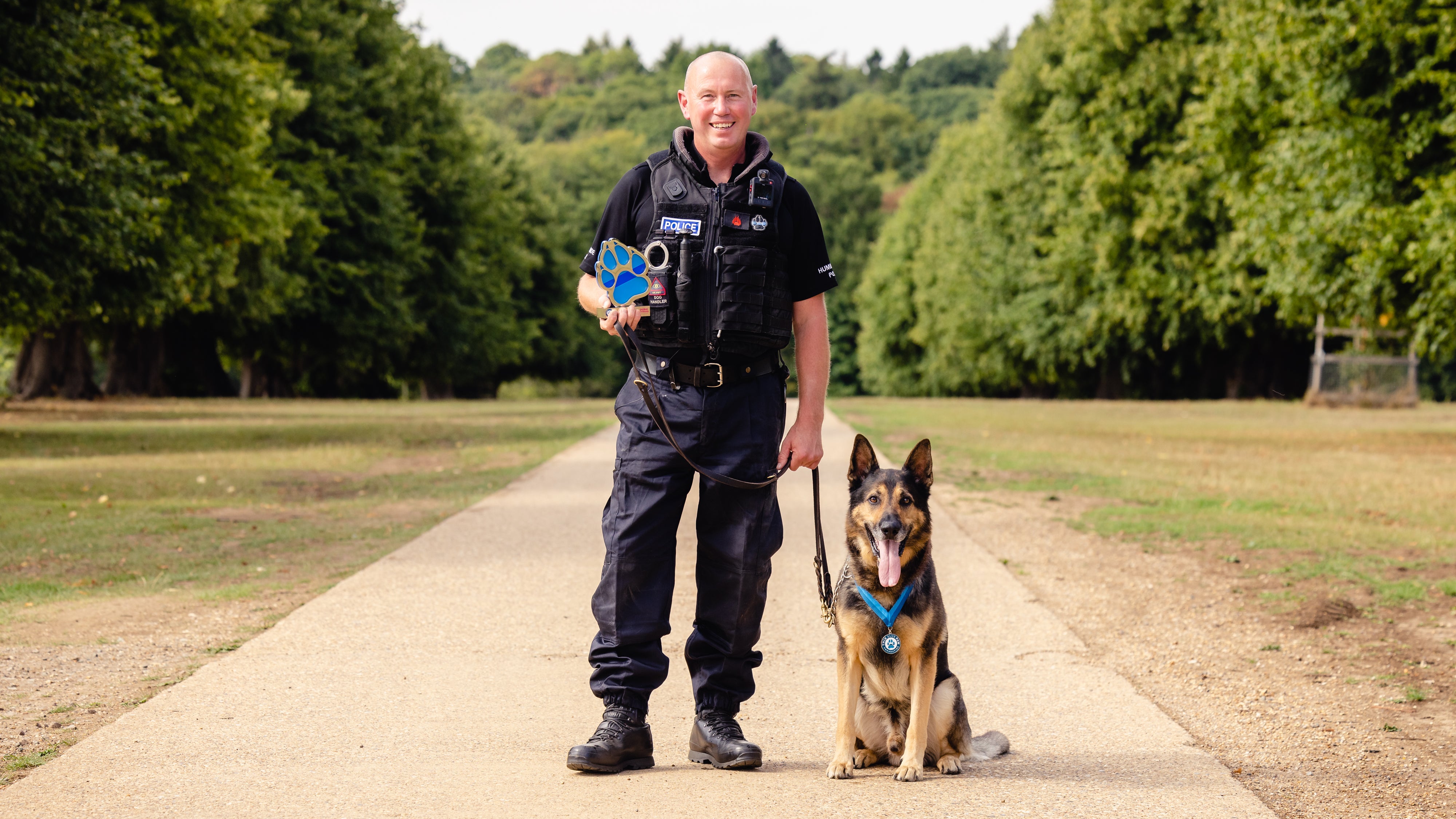 PC Ian Sweeney with his German Shepherd RPD Logan (Thin Blue Paw Foundation/PA)