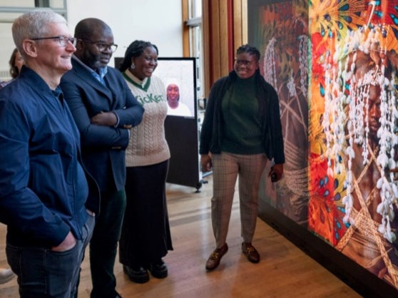 Apple CEO Tim Cook, Soutbank Centre chair Misan Harriman, and Sofia Mpanda and Grace Olanma Etigwe-Uwa, who were both part of Photo-Fantastic