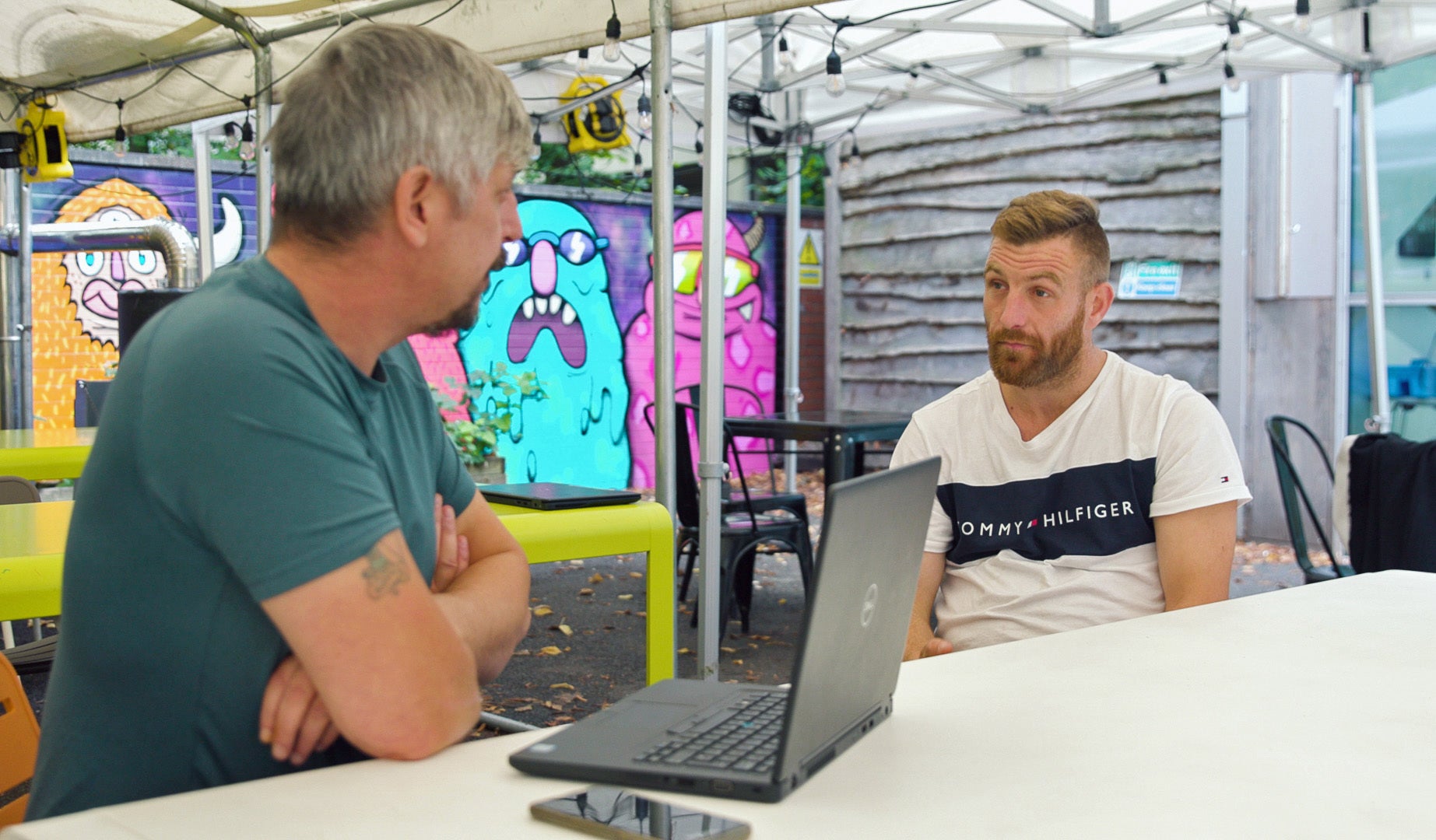 James Bradbury (right), who is studying to work in construction, with Big Issue group frontline worker Shane Ludlam (Chocolate Films/PA)