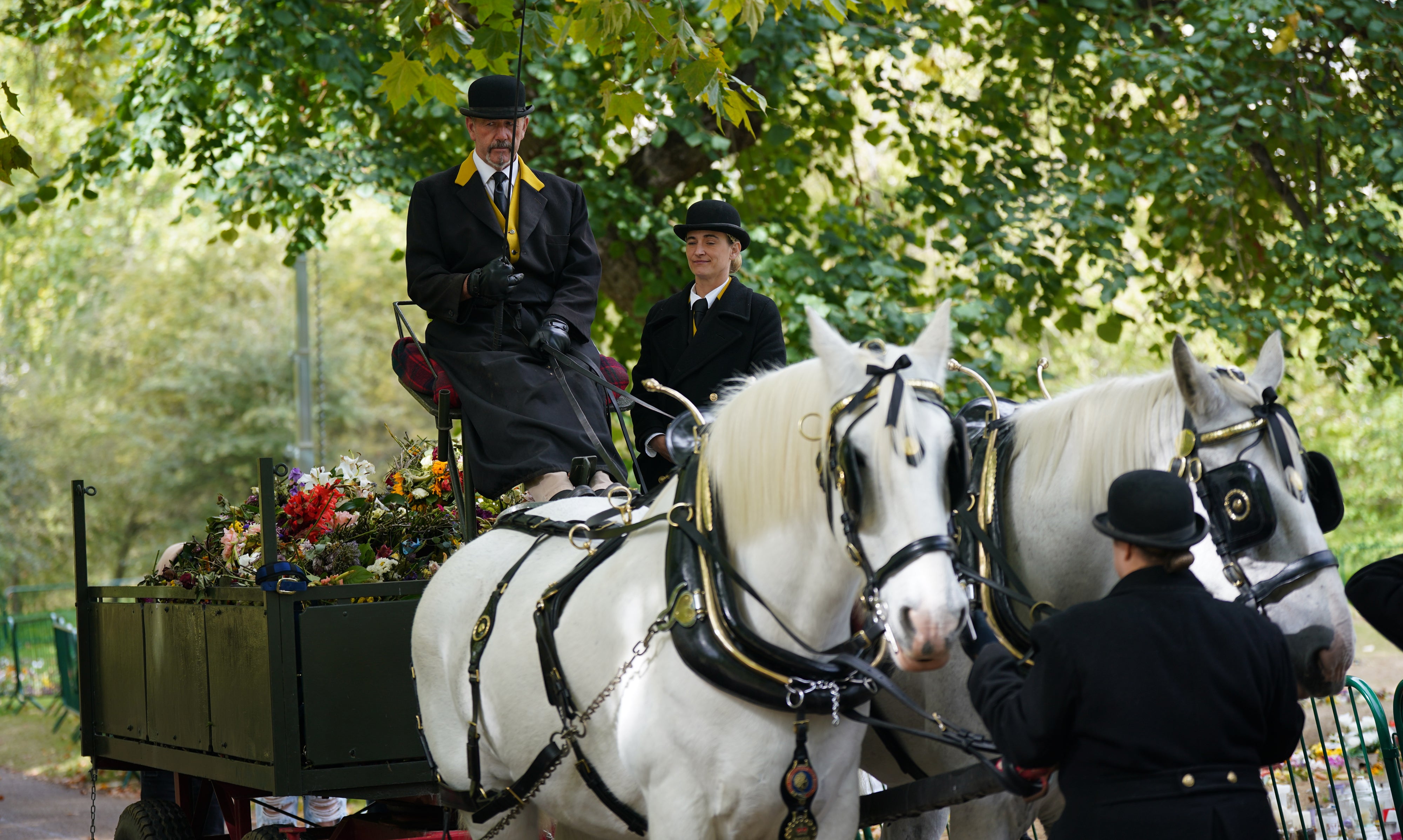 A number of horses were enlisted to help transport floral tributes left for the Queen from Green Park to Kensington Gardens (Yui Mok/PA)