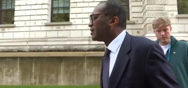 Kwasi Kwarteng walks on as he’s questioned about the pound’s performance against the dollar