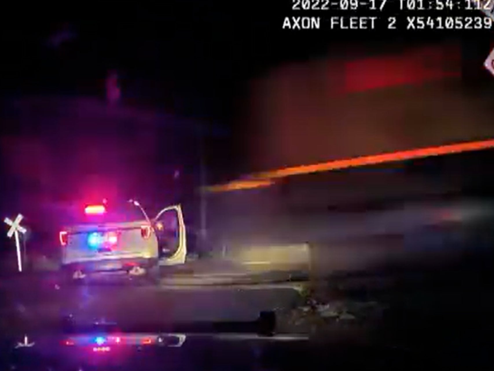 The moment before a train impacts a Platteville, Colorado police cruiser. Yareni Rios-Gonzalez, 20, who was being detained while police searched her truck after a stop involving a road rage incident, was inside the cruiser when the train hit