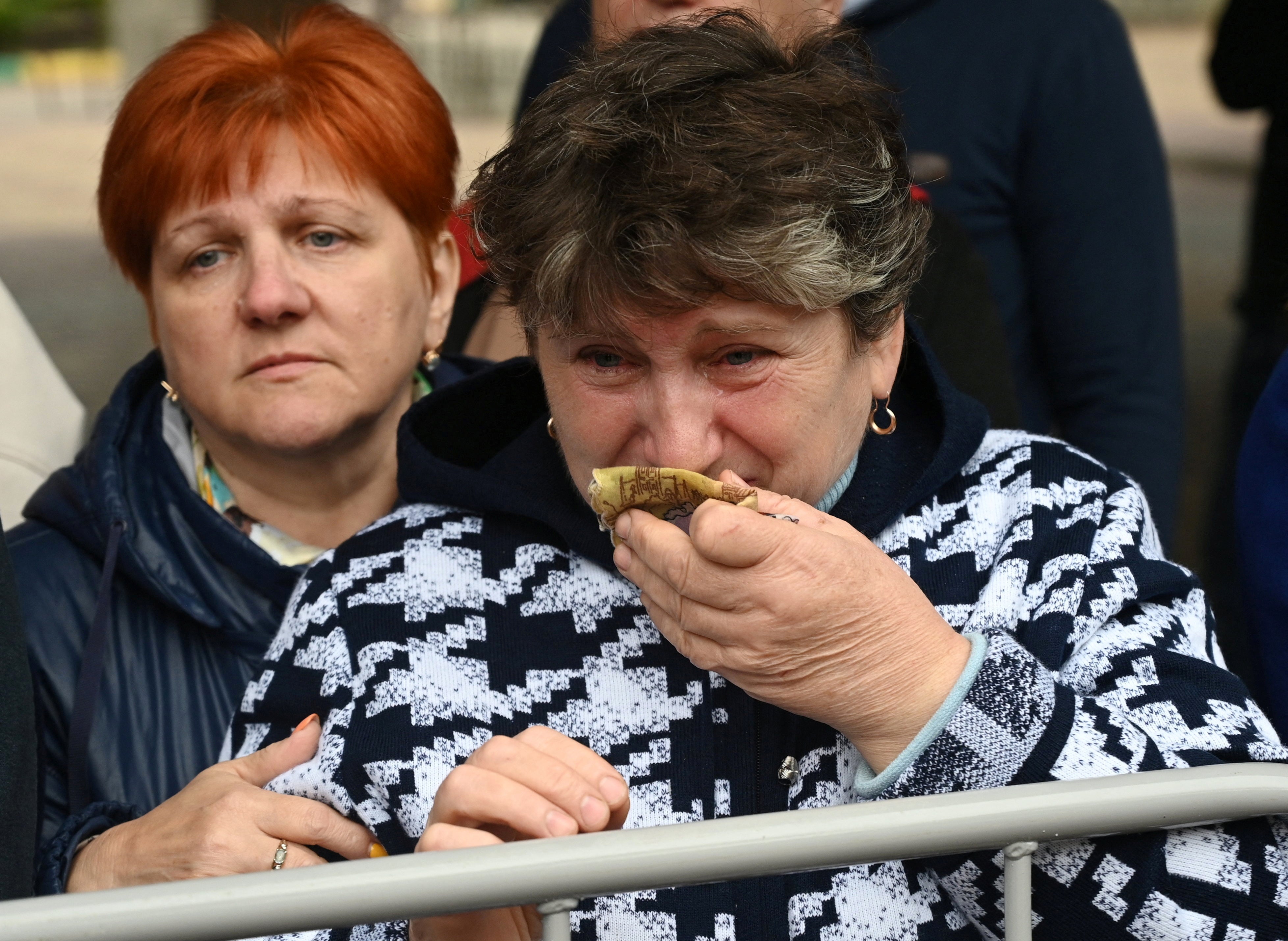 A woman in the city of Bataysk reacts as reservists drafted during partial mobilisation depart for military bases