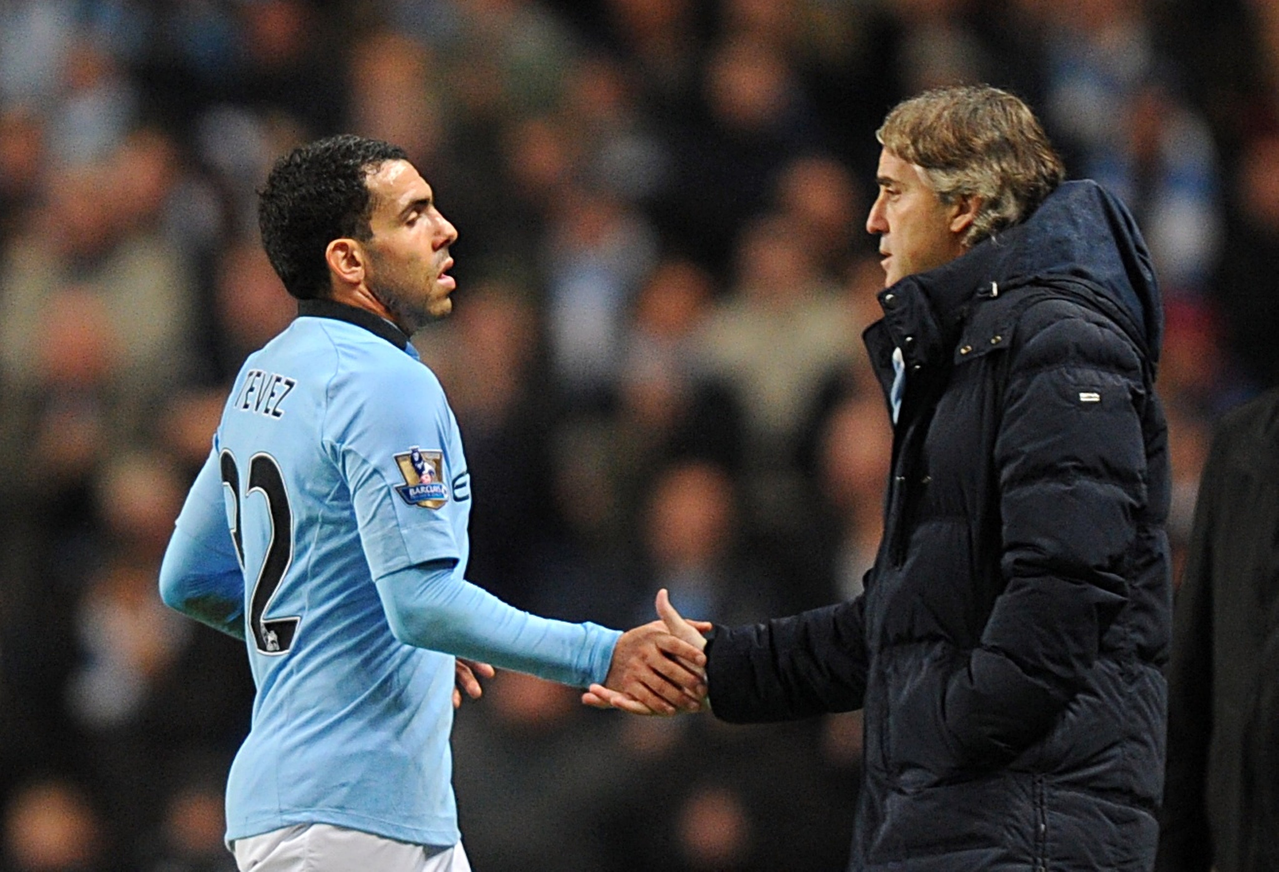 Roberto Mancini, right, and Carlos Tevez fell out over an incident in Munich (Martin Rickett/PA)