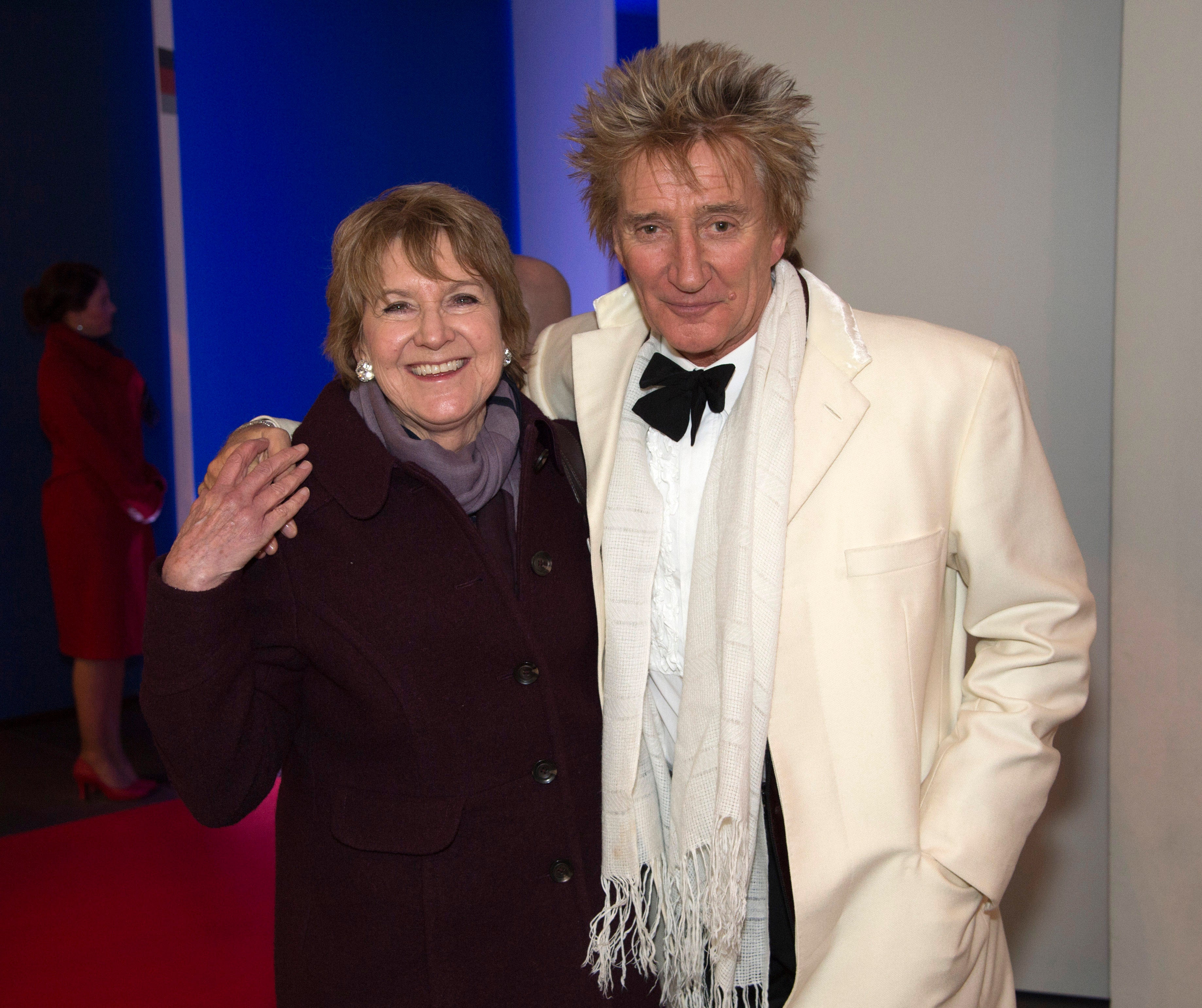 Rod Stewart and Deidre Sanders pose for a photo at A Night of Heroes: The Sun Military Awards 2014 at the National Maritime Museum on December 10, 2014