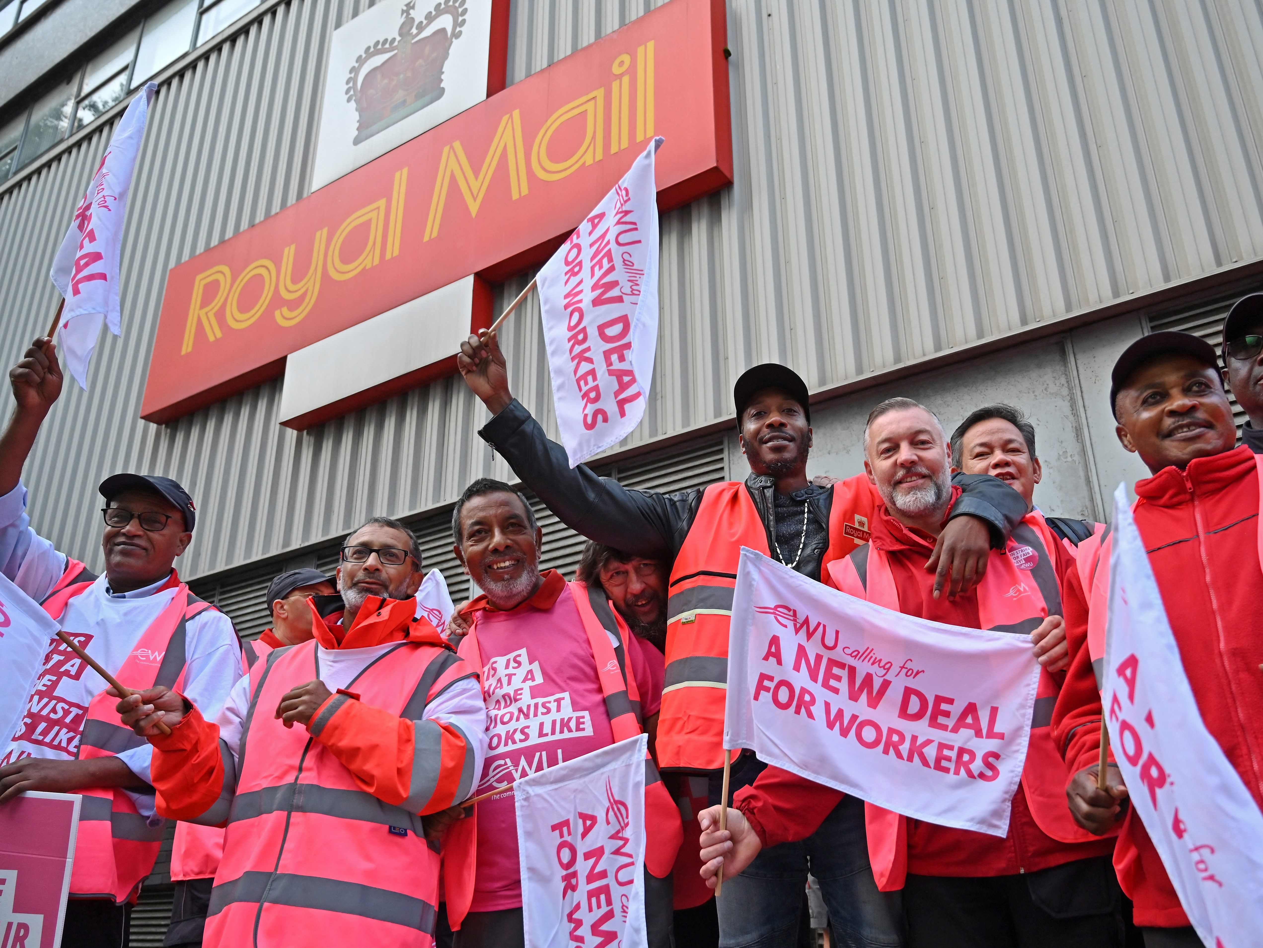 Royal Mail postal workers picket outside a delivery office, in north London on 8 September