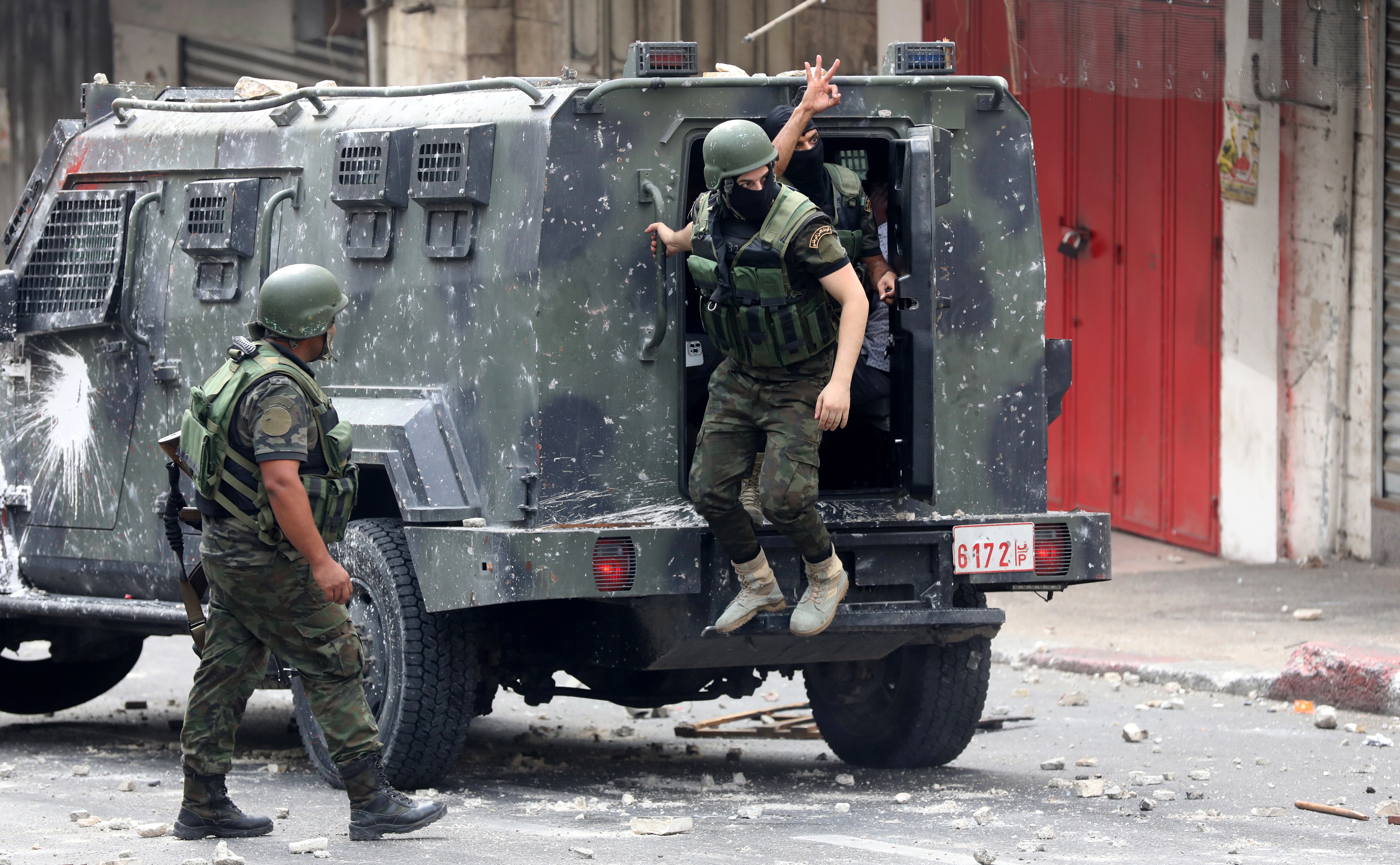 Palestinian Authority security forces during clashes with Palestinain protesters in the West Bank city of Nablus in September