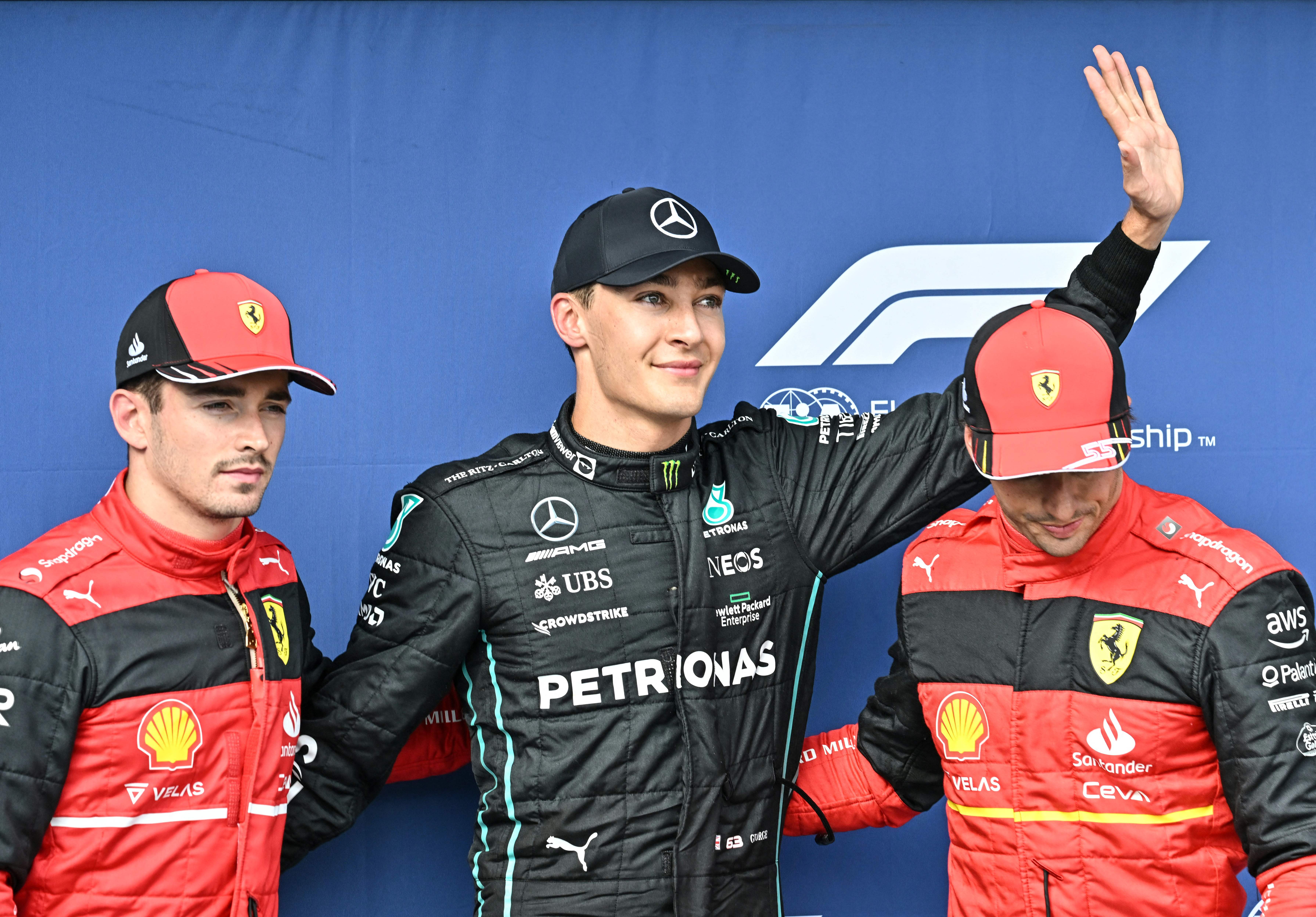 George Russell (centre) celebrates his pole position in Hungary in July