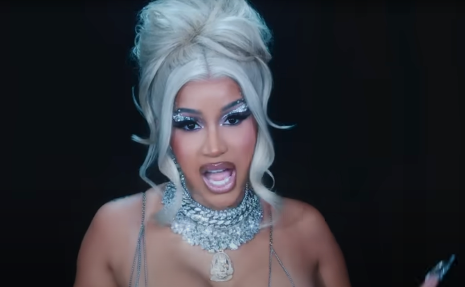 Cardi B wearing ‘Call of Duty’ necklace in ‘Hot S***’