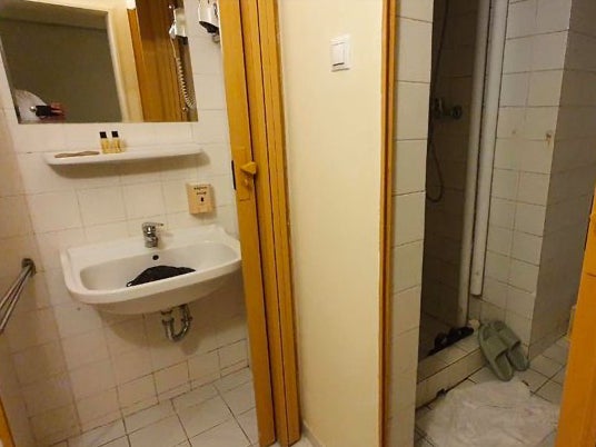 The group of six shared this bathroom in the ‘out-of-service’ room at the fully-booked hotel