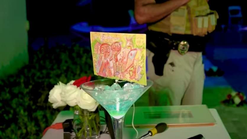 The martini glass with Kahlo’s drawing in it. The drawing was then set on fire.