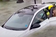 Dramatic video shows moment a Florida woman is rescued from nearly submerged car during Hurricane Ian flooding