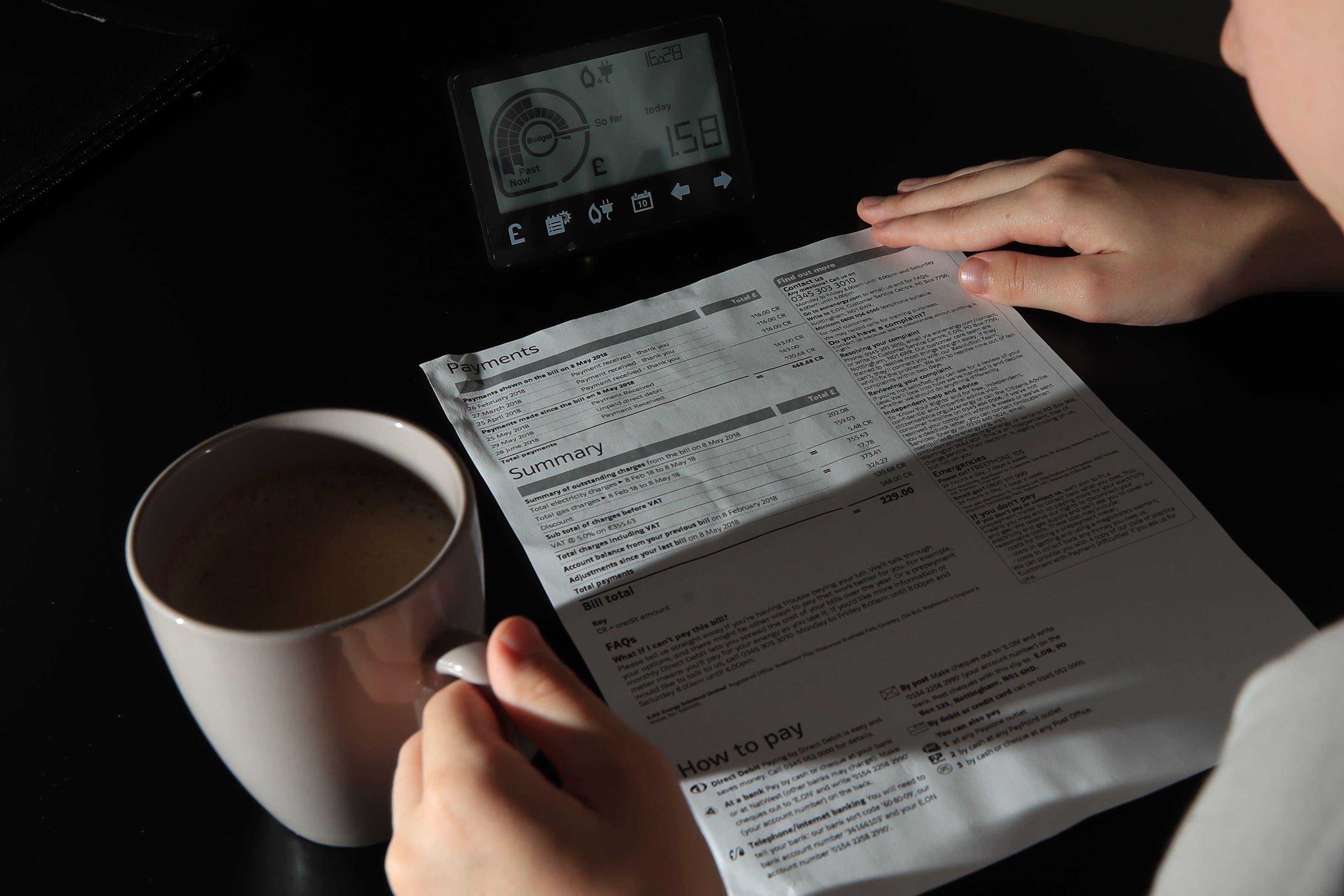 A smart meter next to an energy bill (Peter Byrne/PA)