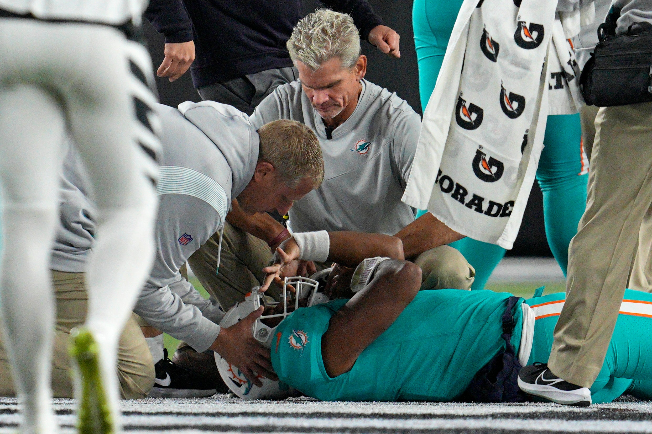 Tua Tagovailoa lies on the field before being stretchered off on Thursday