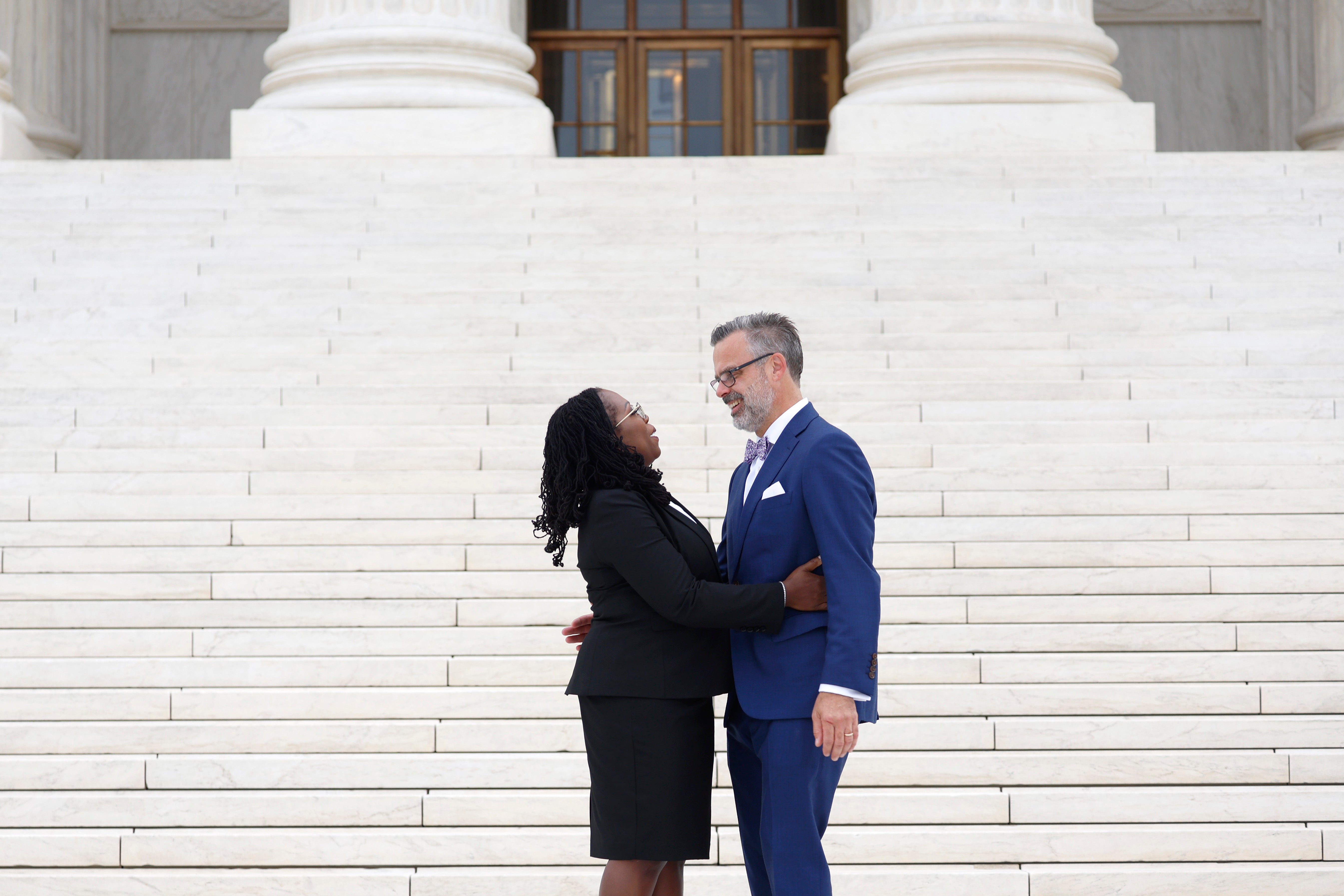 Justice Ketanji Brown Jackson kisses her husband Patrick Jackson in front of the US Supreme Court following her investiture ceremony on 30 September.