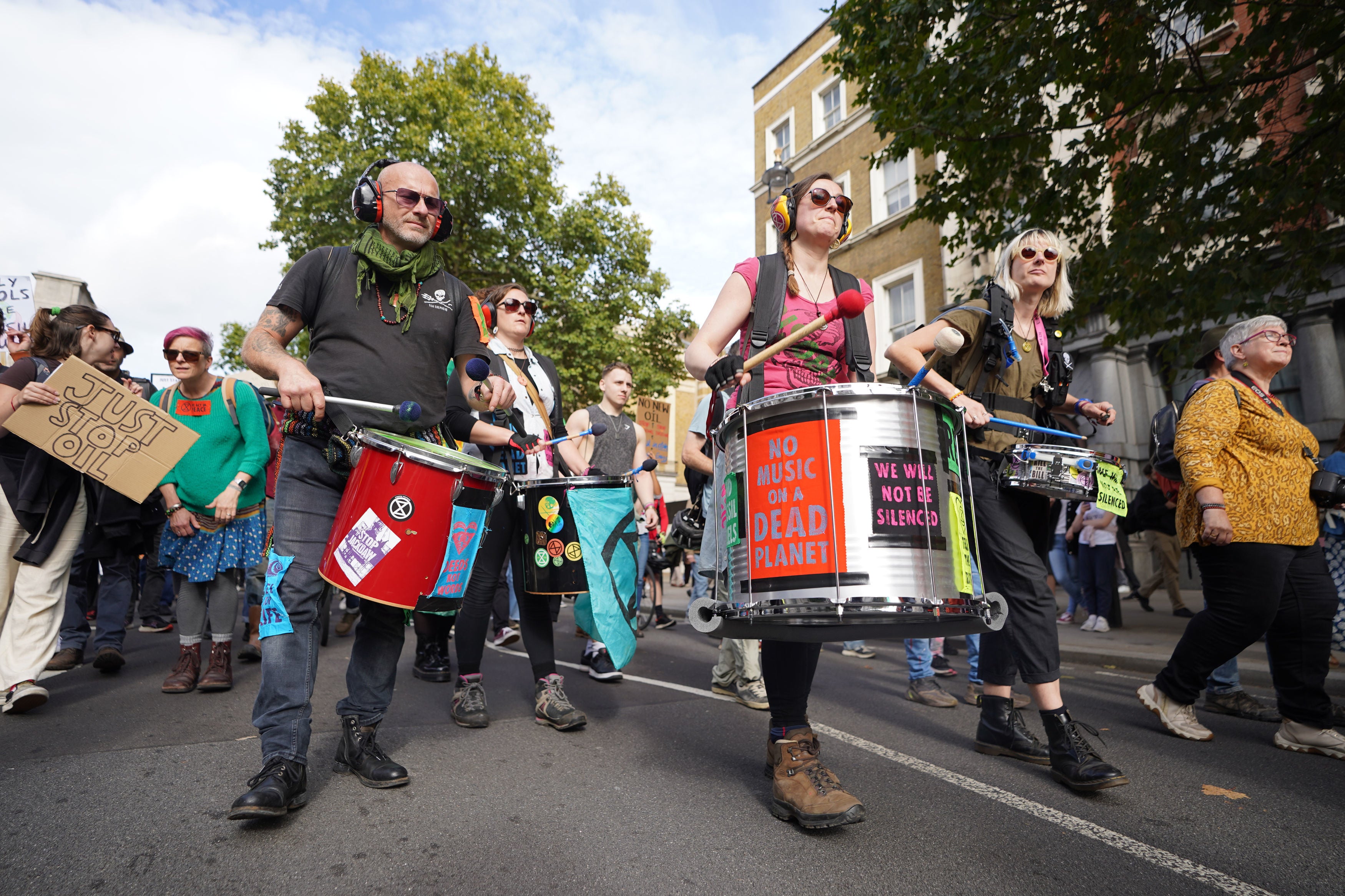 Extinction Rebellion drummers take part in a Just Stop Oil and XR protest in Whitehall, central London