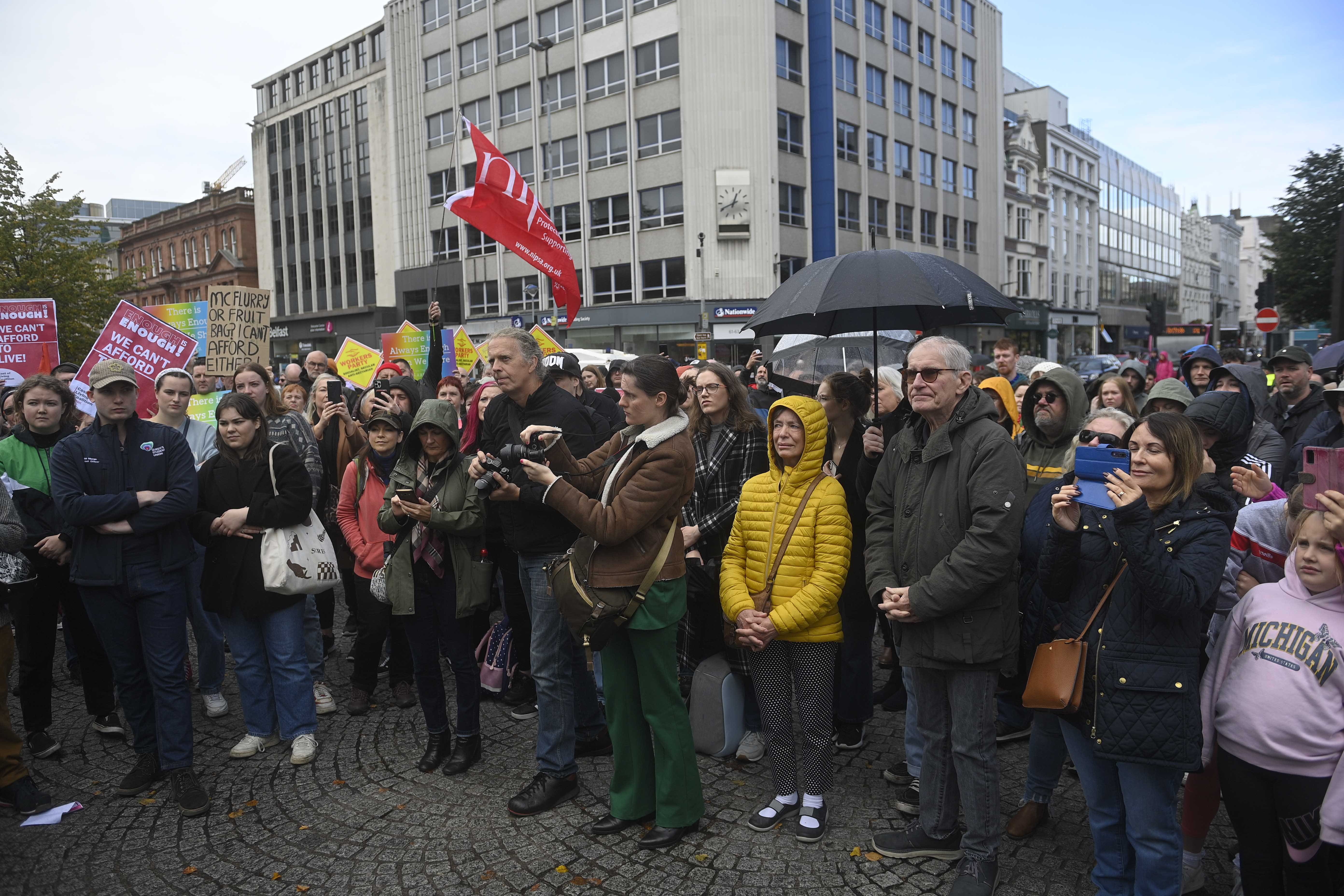 People take part in an Enough is Enough rally at Belfast City Hall (Mark Marlow/PA)