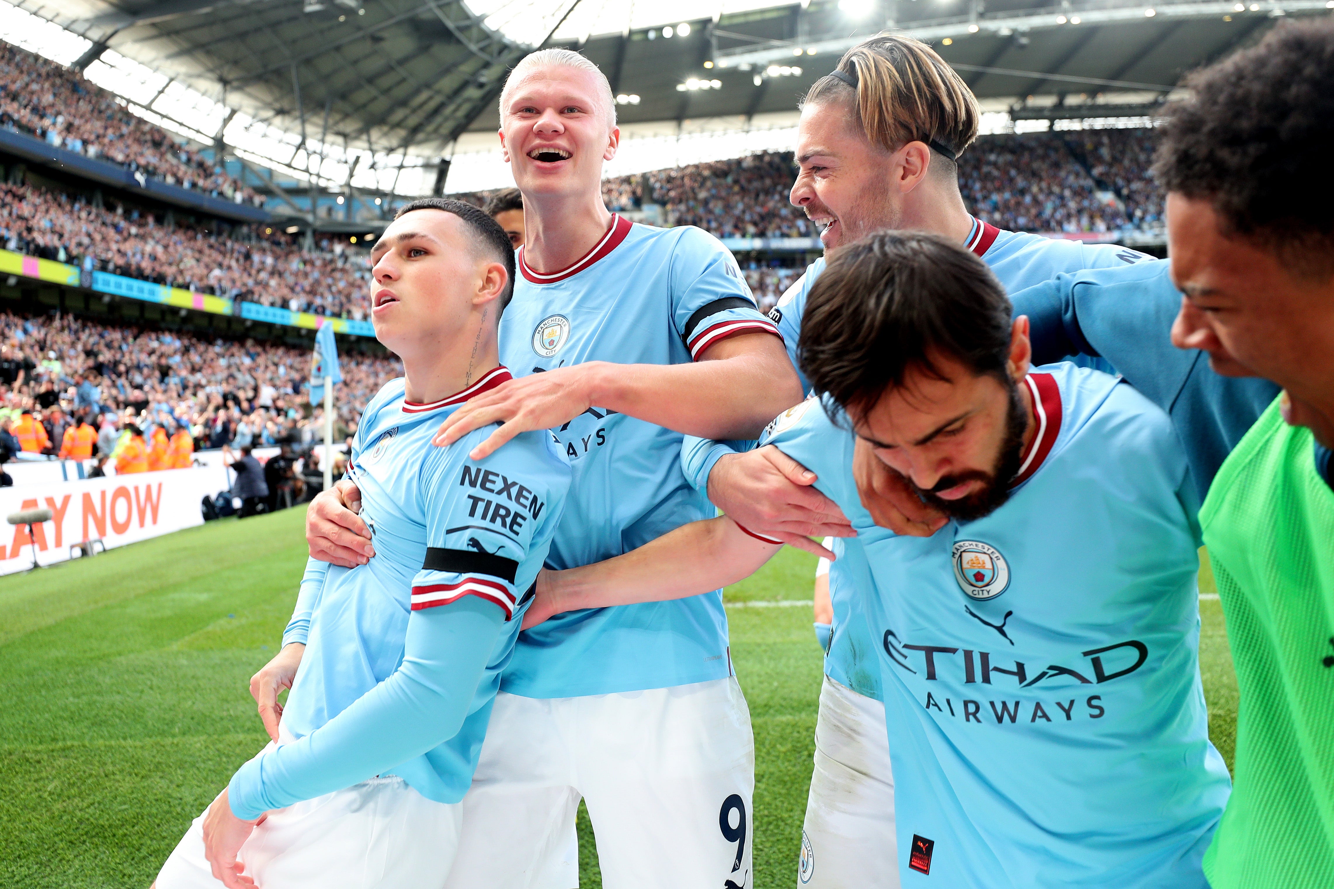 Phil Foden of Manchester City celebrates their sides first goal with team mates Erling Haaland, Jack Grealish and Bernardo Silva