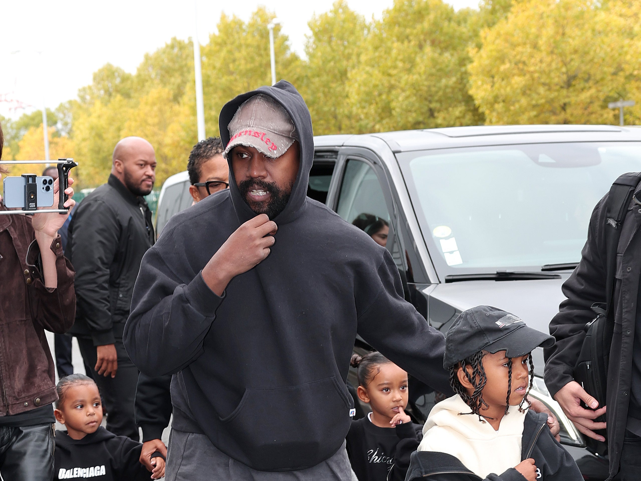 Kanye West makes modelling debut walking Balenciaga’s mud-track runway at Paris Fashion Week