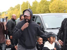 Kanye West makes modelling debut walking Balenciaga’s mud-track runway at Paris Fashion Week