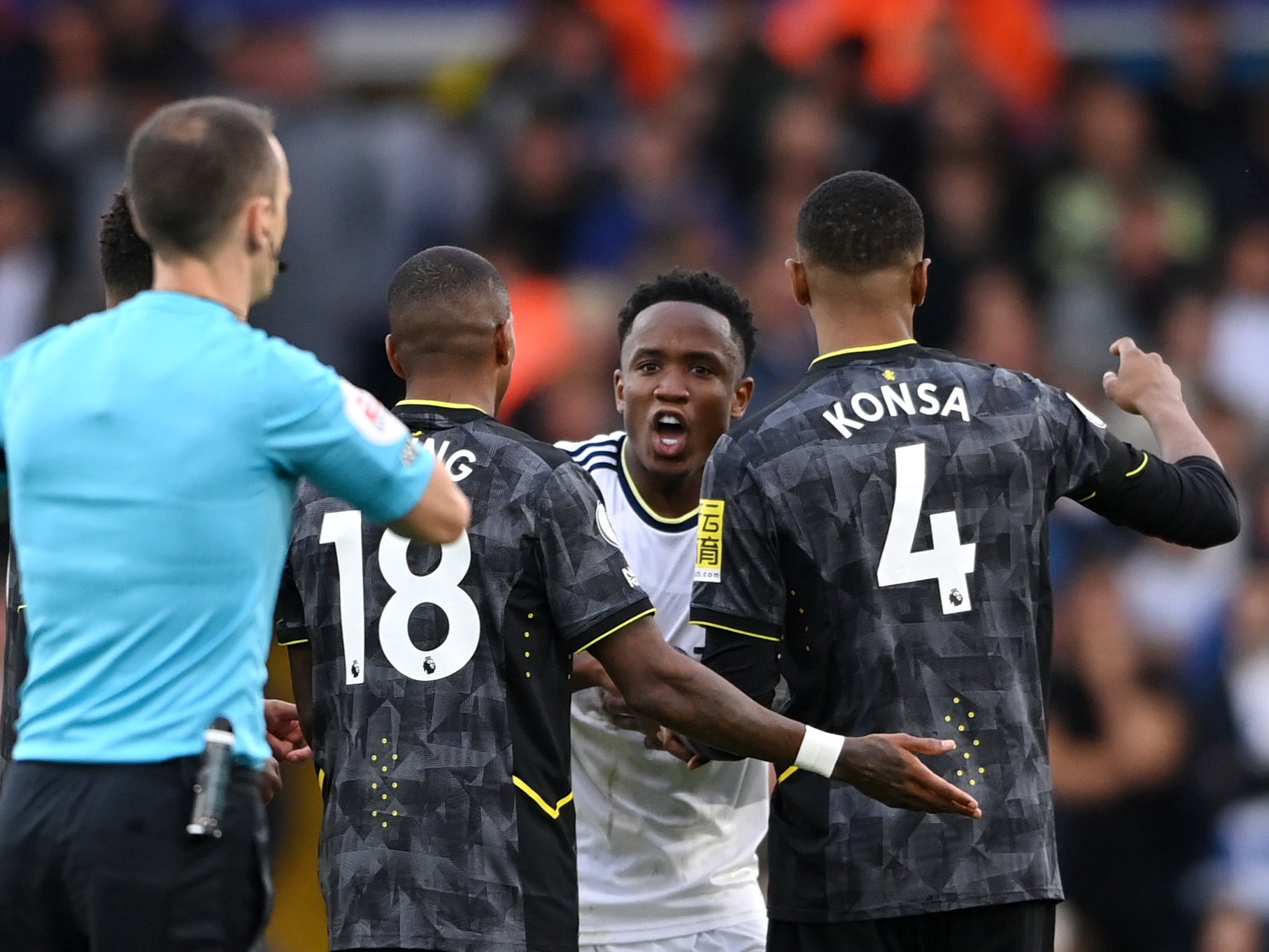 Luis Sinisterra (centre) protests his sending-off for Leeds against Aston Villa